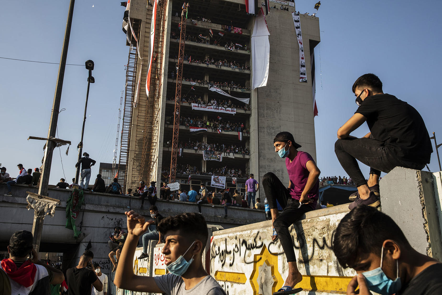 Thousands of people flood Tahrir Square in Baghdad for an anti-government protest, Nov. 1, 2019. (Ivor Prickett/The New York Times)