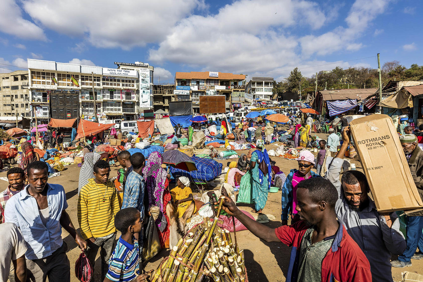 Throngs of shoppers and traders in the Christian market, outside the Showa Gate of Harar Jugol, Ethiopia, Feb. 10, 2019. (Marcus Westberg/The New York Times)