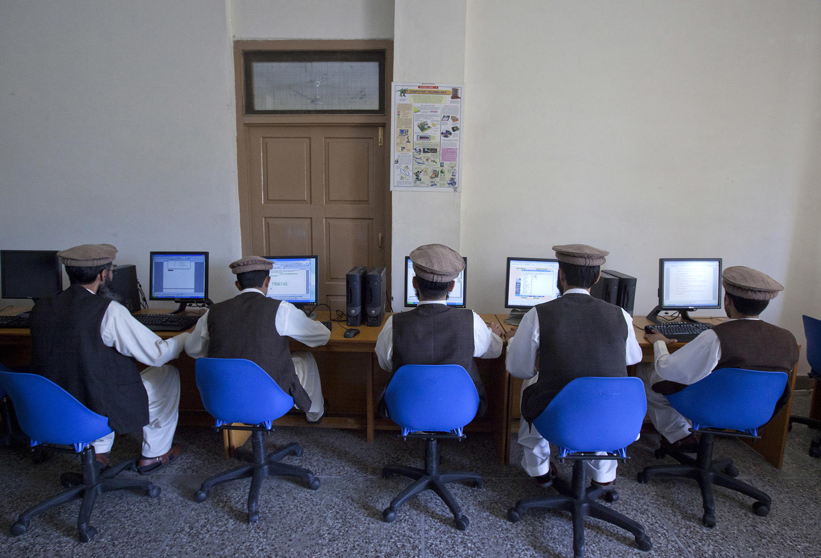 Men learn to use computers in a classroom at Pakistan’s Mishal Deradicalization and Emancipation Program in April 2012. (Mian Khursheed/Reuters)