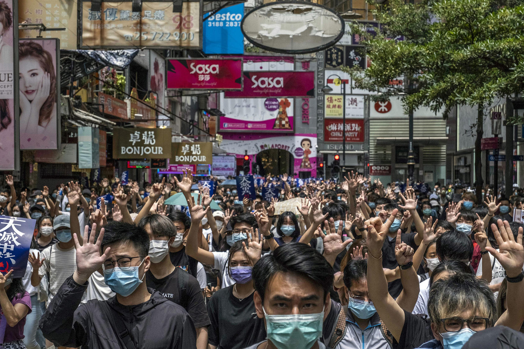 Anti-government protesters march in Hong Kong on Sunday, May 24, 2020. (Lam Yik Fei/New York Times)