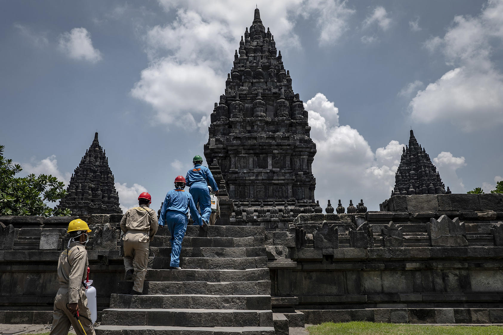 Workers prepare to disinfect the Prambanan temple complex in Yogyakarta, Indonesia, March 17, 2020. (Ulet Ifansasti/The New York Times)