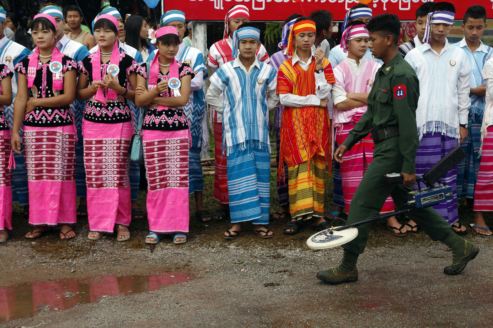 A soldier from the Myanmar army provides security as ethnic Karens attend a ceremony to mark Karen State Day in Hpa-an, Karen State, on November 7, 2014. (Photo by Khin Maung Win/AP)