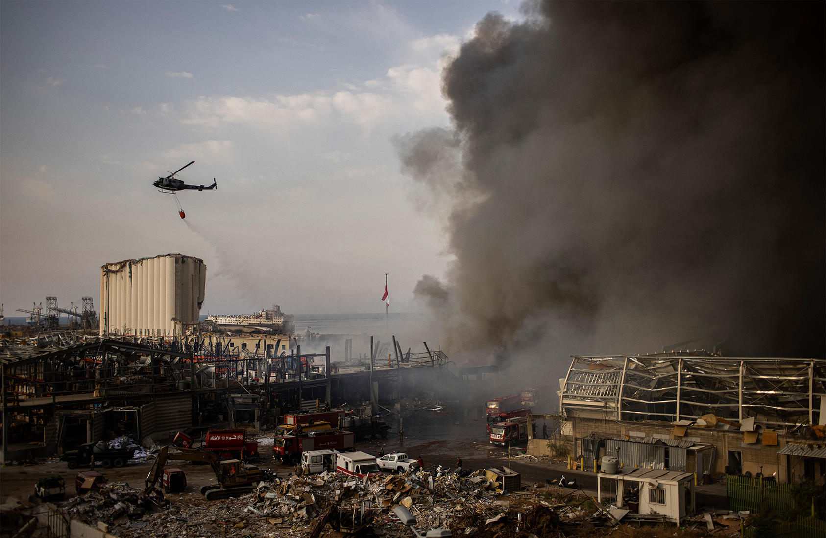 A helicopter drops fire retardant on a large fire that erupted in Beirut’s port on Thursday, Sept. 10, 2020, terrifying residents still recovering from the horrific Aug. 4 port explosion. (Diego Ibarra Sanchez/The New York Times)