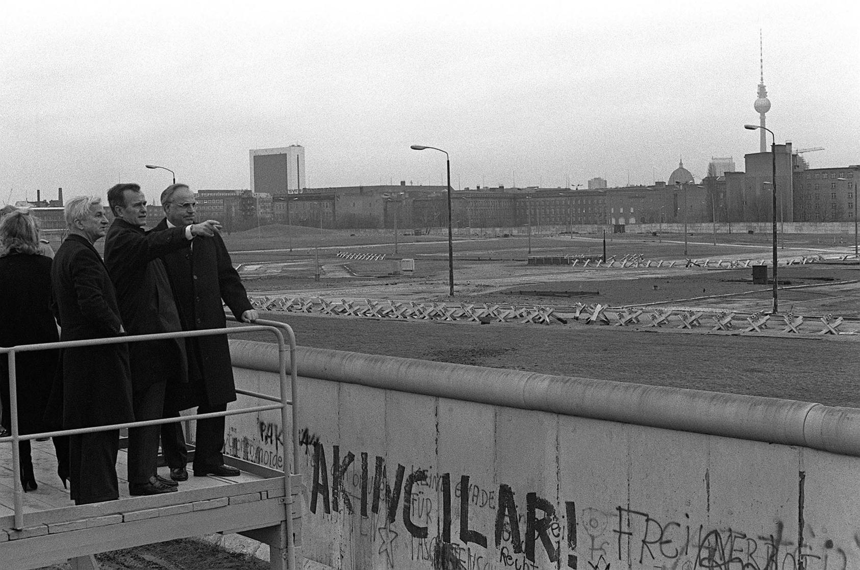 Vice President George H.W. Bush looks over the Berlin Wall into East Berlin,  escorted by West Berlin Mayor Richard von Weizacker and German Chancellor Helmut Kohl, February 1, 1983. (U.S. Department of Defense)