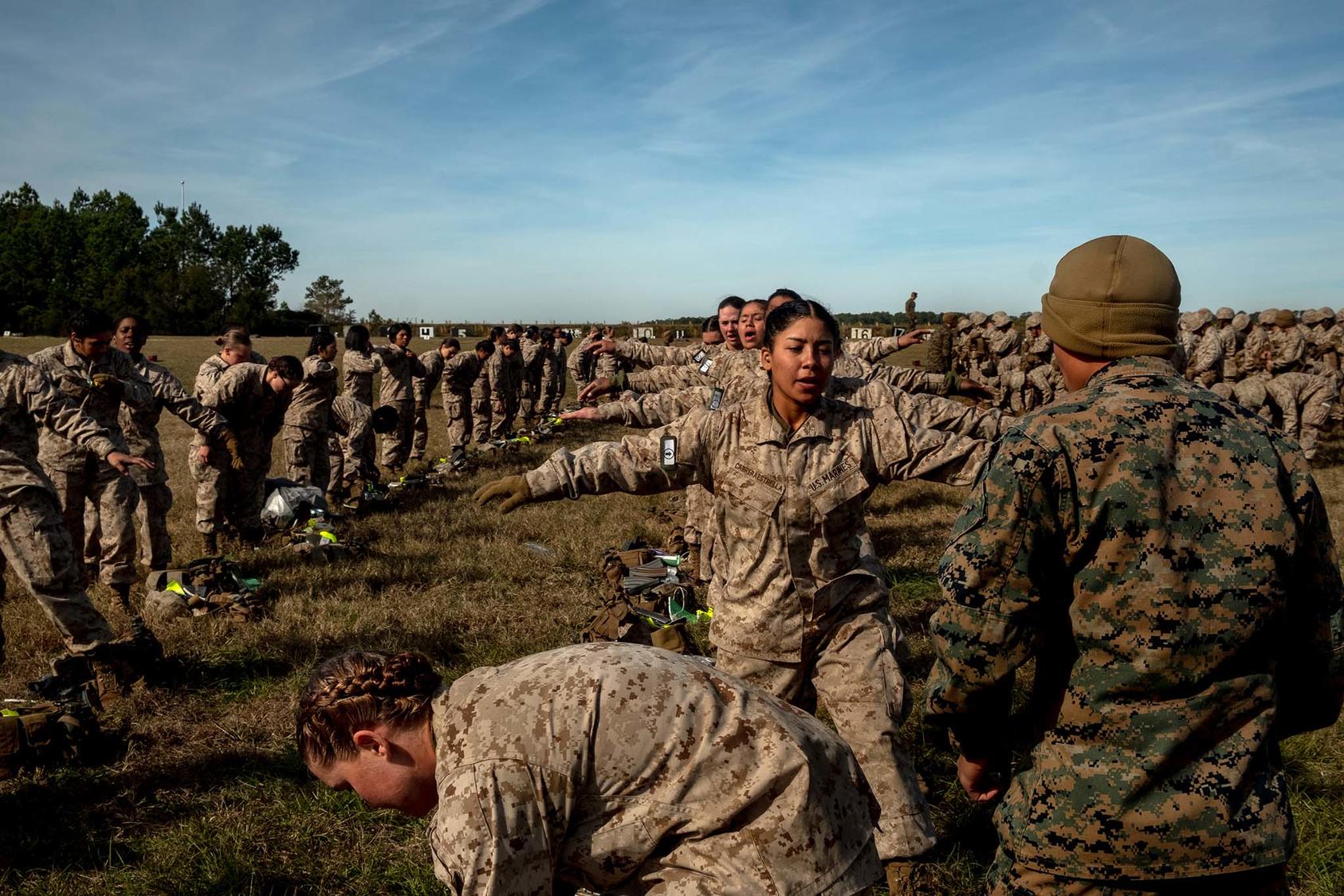 Marine recruits at Parris Island, S.C. while getting checked for weapons after a drill on Dec. 20, 2019. (Hilary Swift/The New York Times)