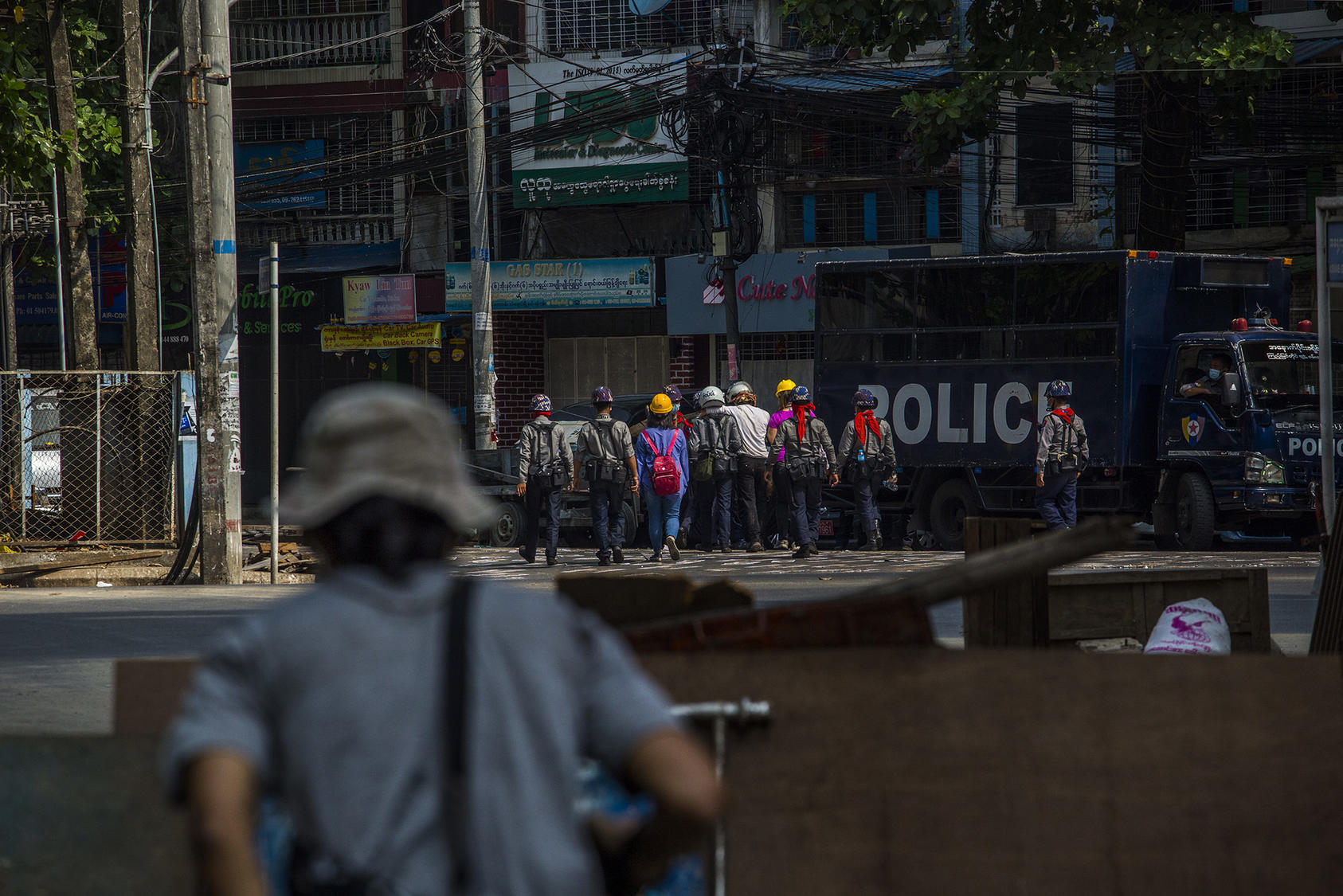 The police take arrested protesters to a prison truck in Yangon, Myanmar, March 3, 2021. (The New York Times)