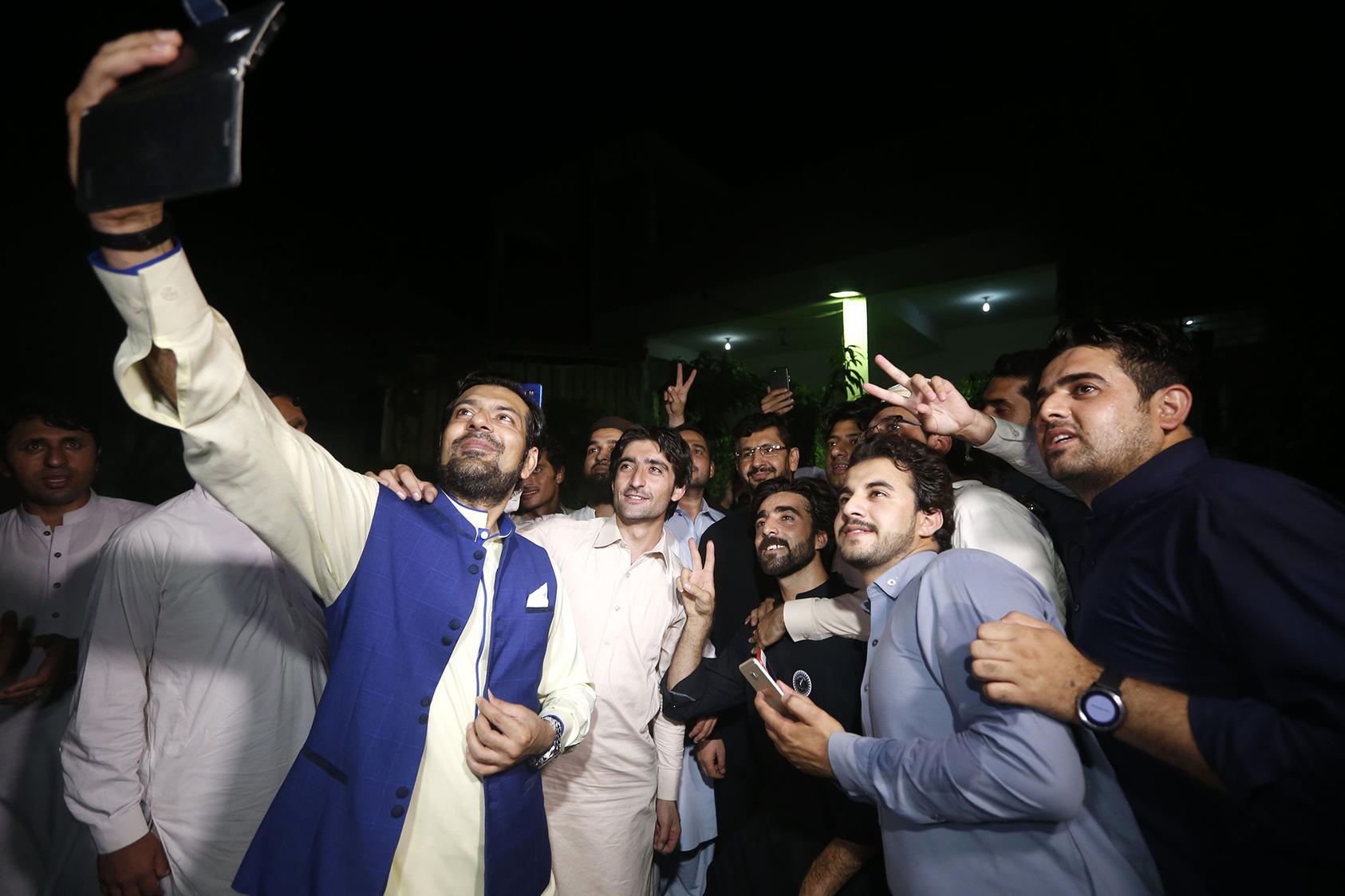 Supporters of the FATA youth jirga celebrate the merger of Khyber Pakhtunkhwa Province and the Federally Administered Tribal Areas in May 2018. (Bilawal Arbab/ EPA-EFE/ Shutterstock)