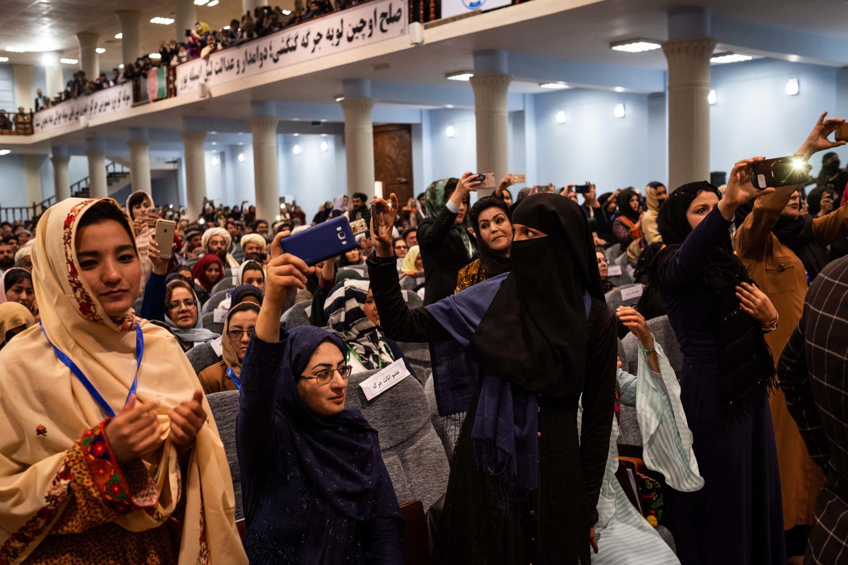 The opening session of a 2019 tribal assembly in Kabul, Afghanistan. Many Afghan women seized on the freedoms that emerged after the American invasion and collapse of the Taliban government in 2001. They do not want to go back to the terms of Taliban rule. (Jim Huylebroek/The New York Times)