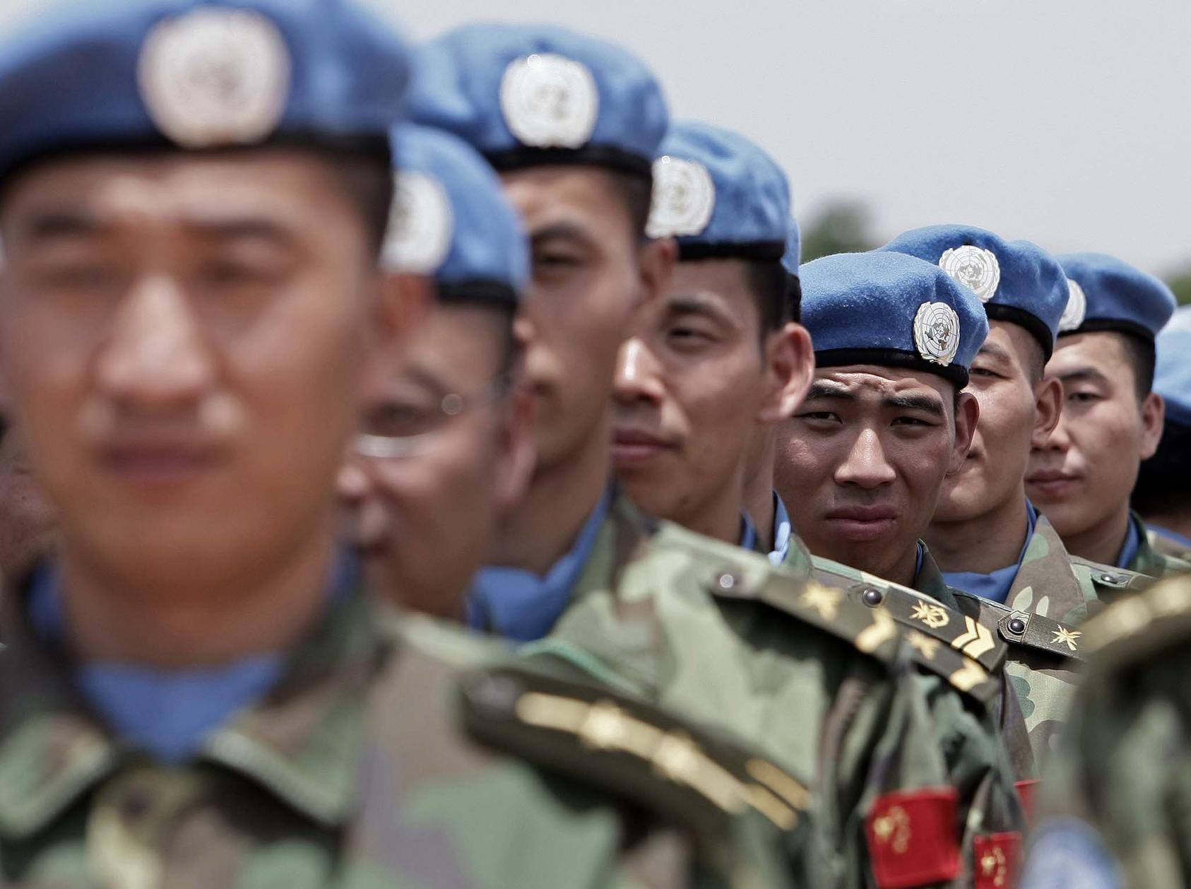 Newly arrived engineers from China serving with the United Nations-African Union Mission in Darfur (UNAMID) arriving in Nyala, South Darfur, July 17, 2008. (U.N. Photo/Stuart Price)