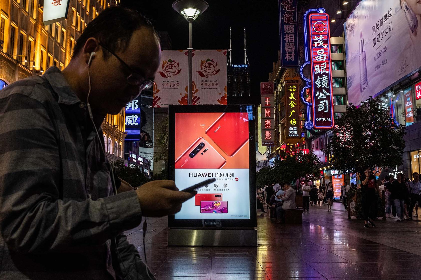 A Huawei billboard in Shanghai, China. The company is reportedly releasing a new operating system that could change Africa’s mobile ecosystem. (Lam Yik Fei/The New York Times)