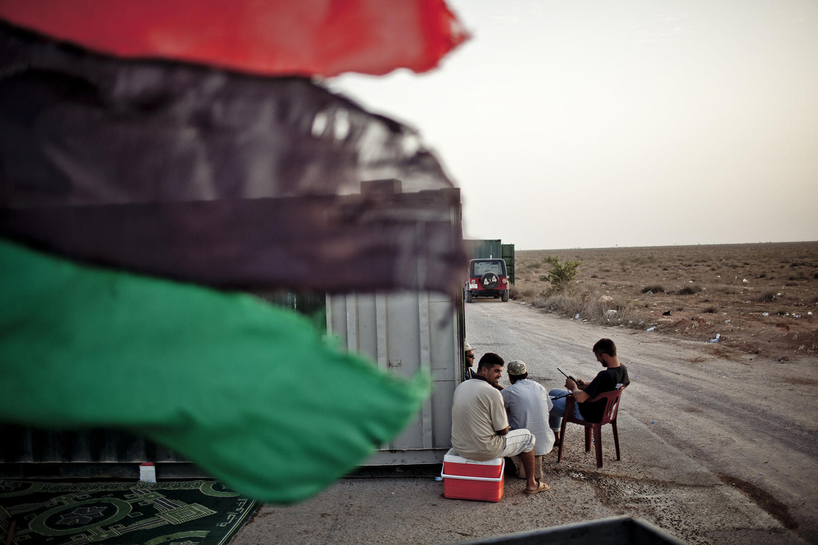 Rebels guard the last checkpoint between Misrata and Bani Walid on the outskirts of Abdul Rauf, Libya, Sept. 5, 2011. (Bryan Denton/The New York Times)