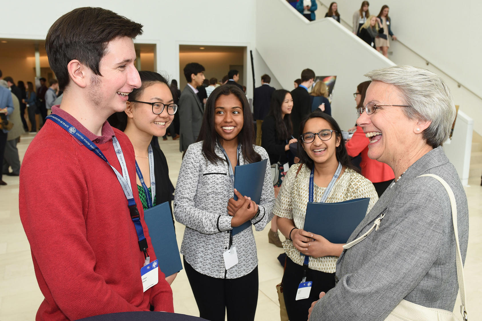 USIP Board member Judy Ansley speaks with Academic WorldQuest students at the 2018 National Competition reception, hosted at the Institute’s headquarters in Washington, DC.