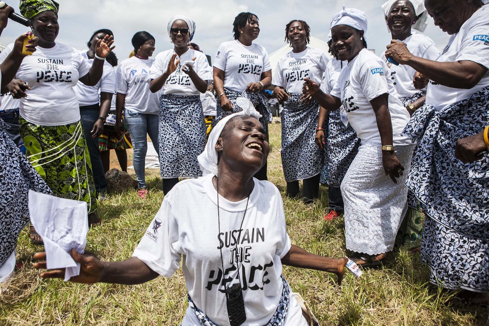 The Women in Peacebuilding Network calls for a peaceful election, in Monrovia, Liberia, Oct. 9, 2017. In 2003, women similarly clad in white organized widescale demonstrations pushing for an end to a 14-year civil war. (Jane Hahn/The New York Times)