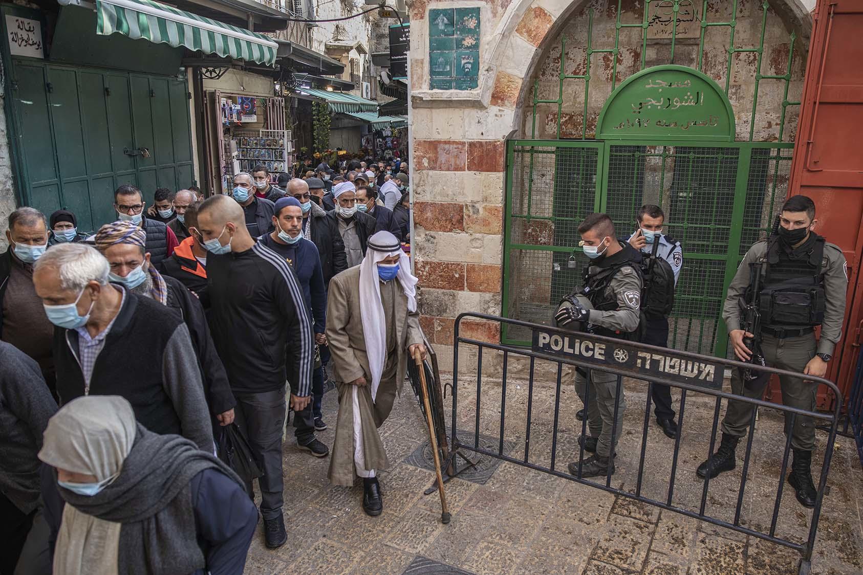 Israeli police stand at their post as Palestinians leave the Dome of the Rock Mosque after Friday prayers in the Old City of Jerusalem on Friday, Nov. 27, 2020. (Dan Balilty/The New York Times)