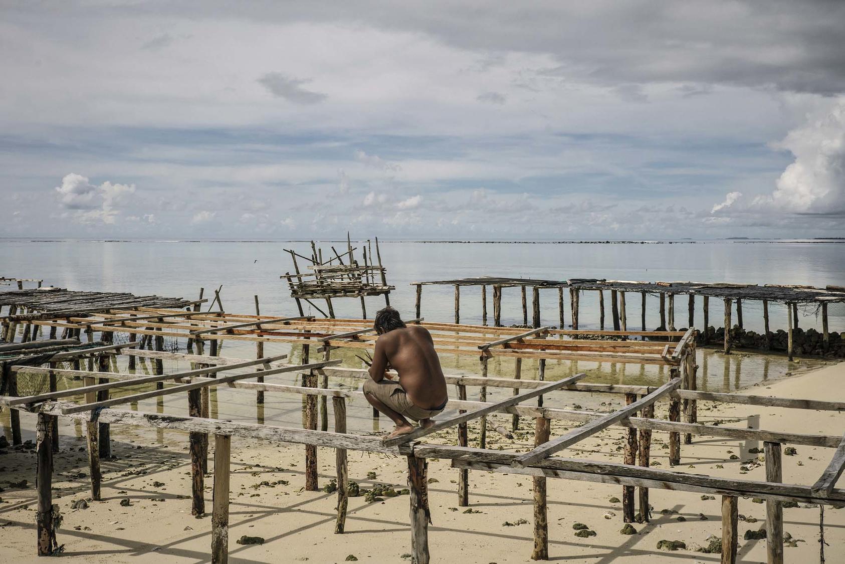 A seaweed drying dock in Beniamina Island, part of the Solomon Islands, June 5, 2018. In many parts of the Solomon Islands, land has disappeared, drowned by heaving currents and rising seas. (Adam Ferguson/The New York Times)