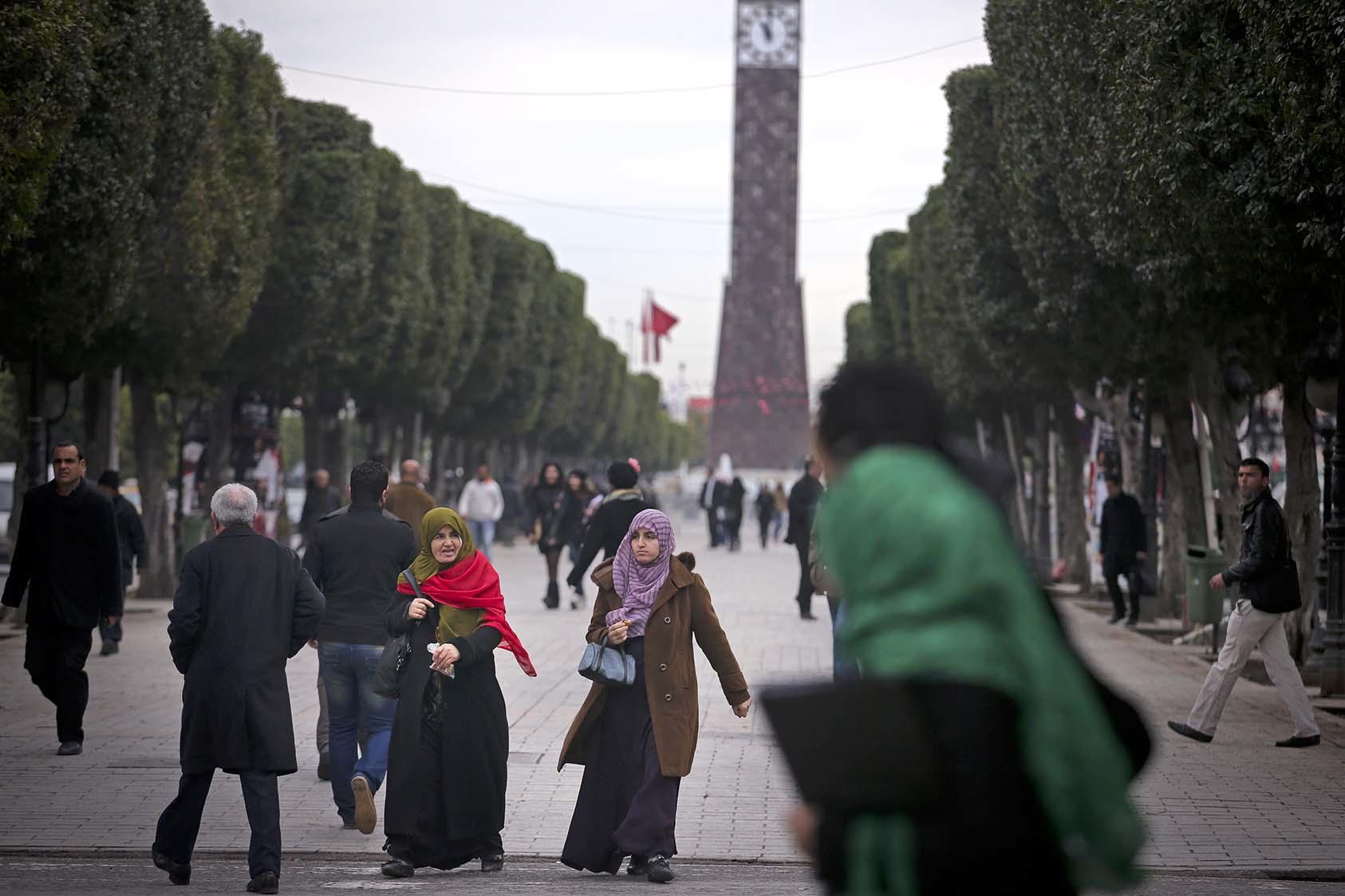 People walk along Avenue Habib Bourguiba in downtown Tunis, Tunisia, Feb. 11, 2013. (Tara Todras-Whitehill/The New York Times)