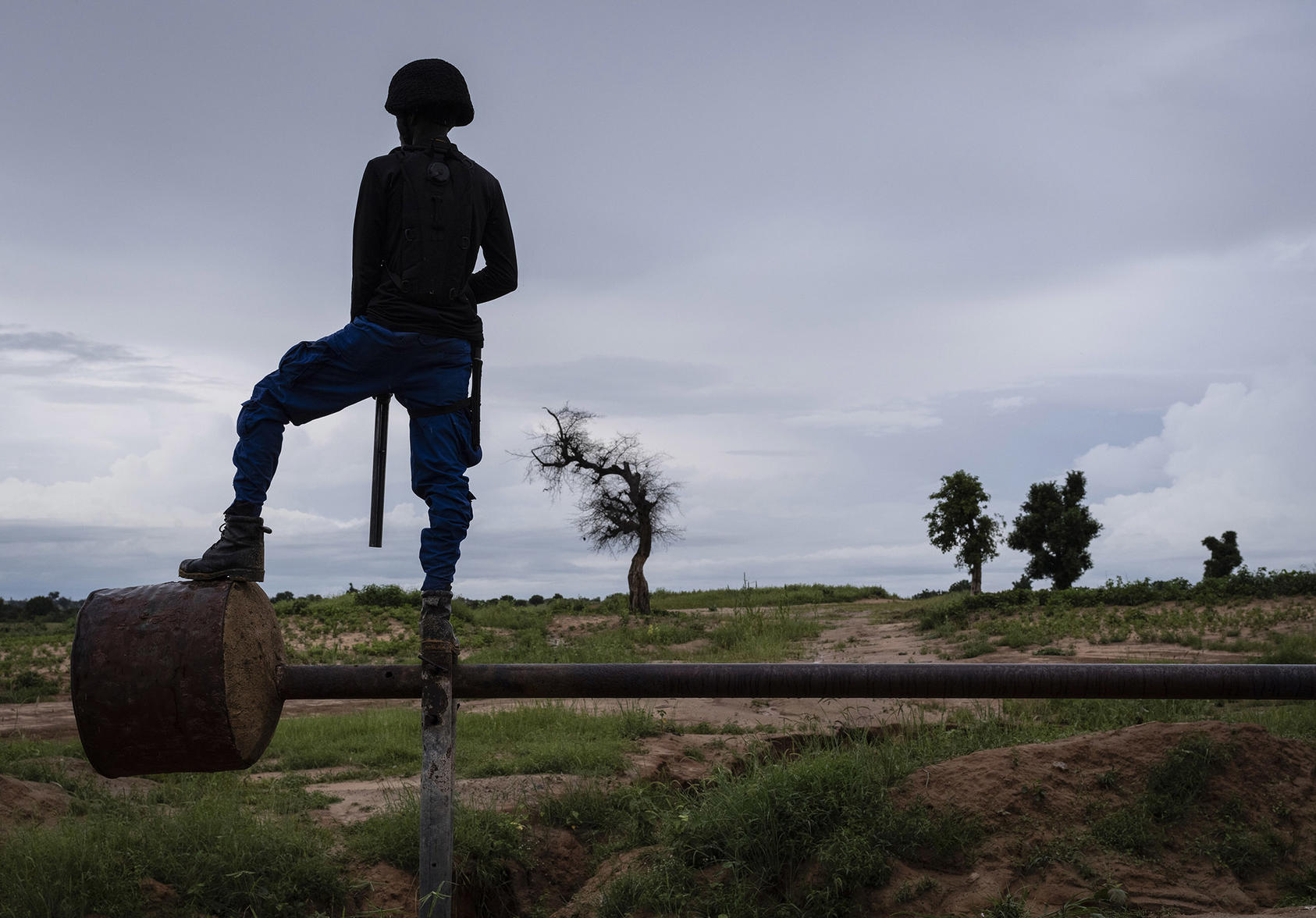 A civilian vigilante serves as a lookout along the last line of defense for the southeastern flank of Maiduguri, the biggest city in northeastern Nigeria, Aug. 22, 2019. (Laura Boushnak/The New York Times)