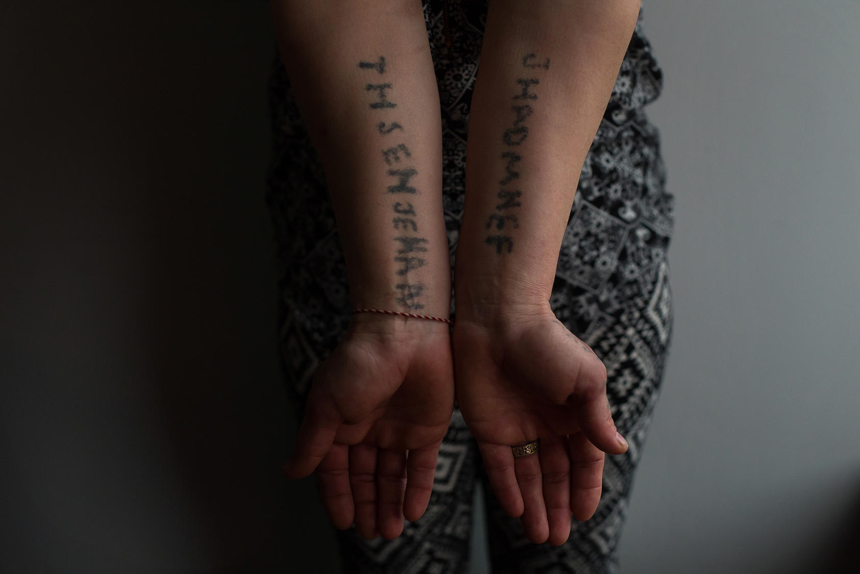 Jihan, a Yazidi seized by ISIS as a sex slave, tattooed relatives’ names onto her body while in captivity. Now a refugee in Canada, Jihan asked that her family name be withheld to protect relatives still held by ISIS. (Amber Bracken/The New York Times)