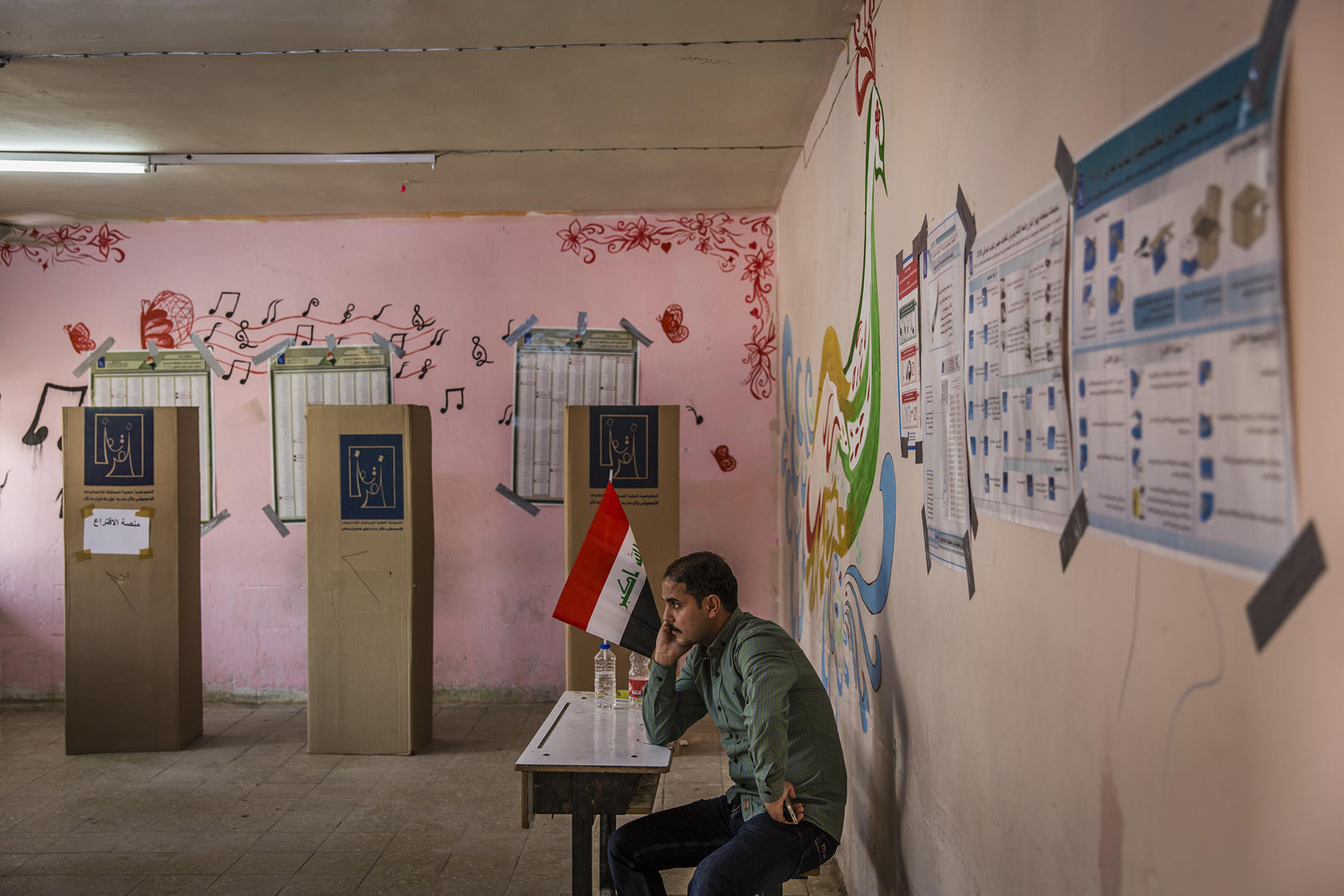A man on duty at a polling place in Baghdad for Iraq's national elections. May 12, 2018. (Ivor Prickett/The New York Times)