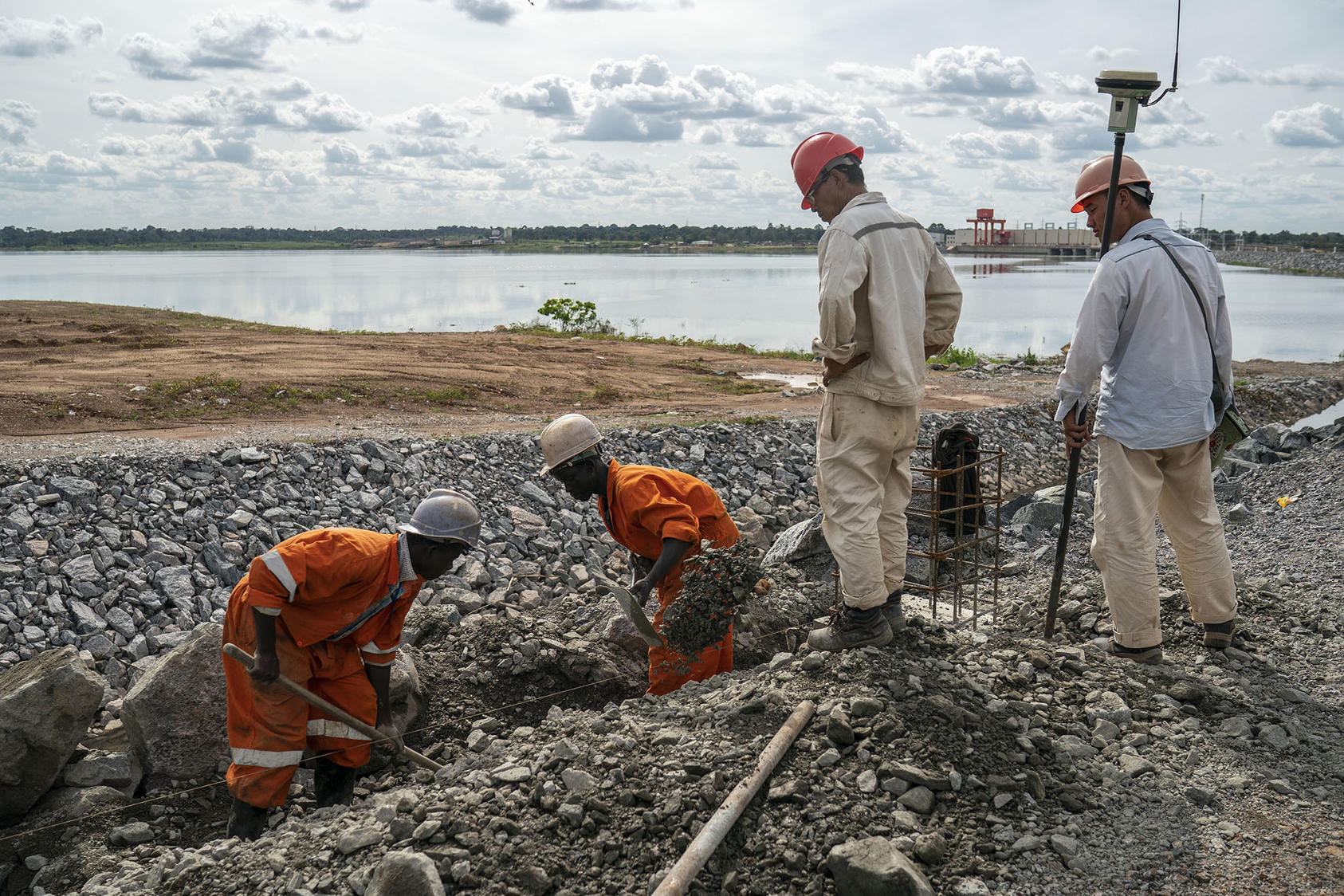 Chinese and Ugandans work on a Chinese-funded hydro power project in Uganda. Civil society groups in many African nations seek better transparency in their governments’ finances, including heavy debts contracted with China. (Joao Silva/The New York Times)