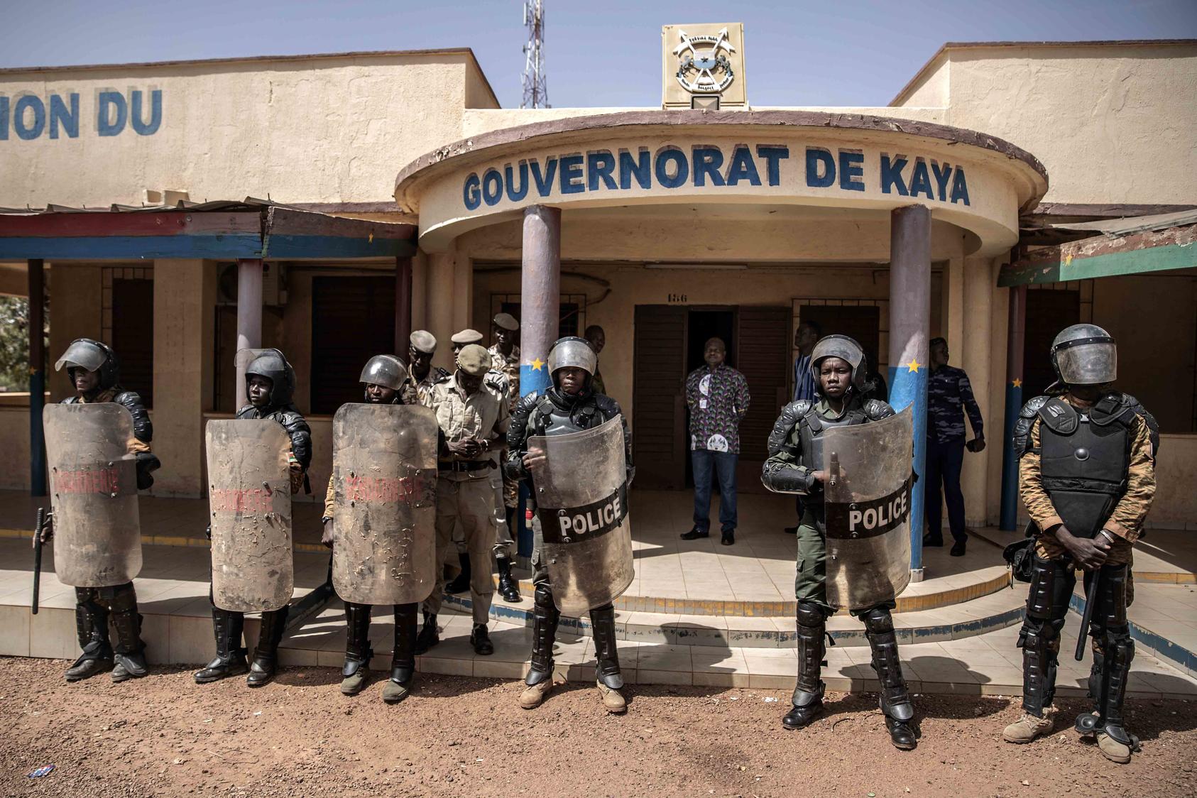 Burkina Faso police protect a provincial governor’s office following protests in 2020. Burkina Faso faces extremist violence and has seen citizens’ protests over problems of governance, as in the town of Manga. (Finnbarr O'Reilly/The New York Times)