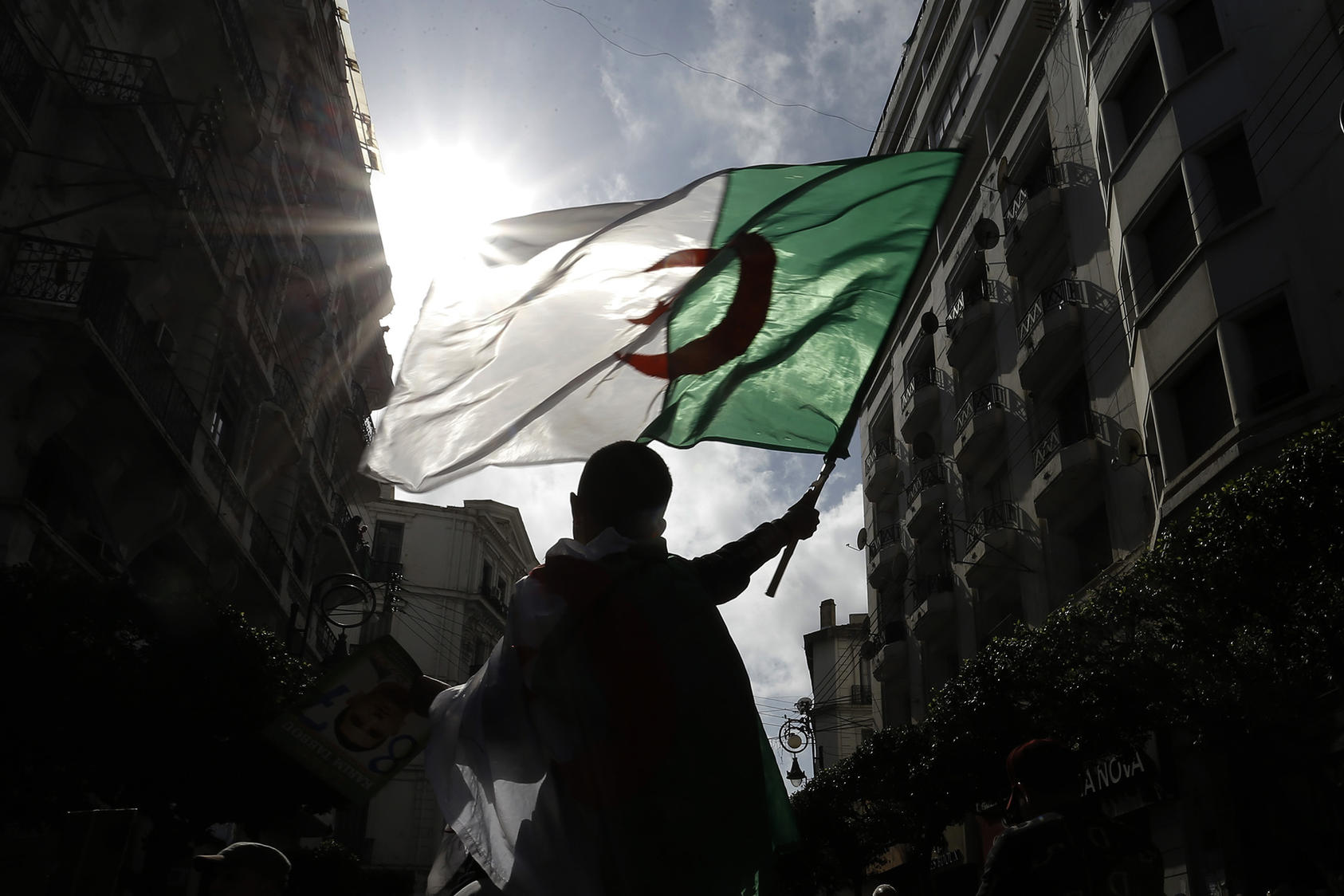 Thousands of Algerians took to the streets to commemorate the first anniversary of the popular protests in Algiers on February 21, 2020. (Photo by Toufik Doudou/AP)