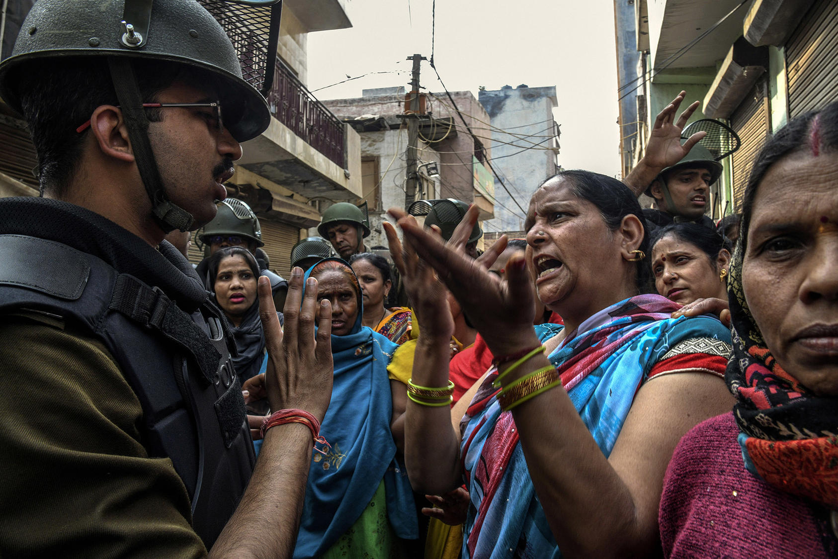 / Residents argue with security personnel in the Shiv Vihar neighborhood of Delhi on Friday, Feb. 28, 2020. The New Delhi police force has been widely criticized for standing by during some of the worst religious violence in years. (Atul Loke/The New York Times)