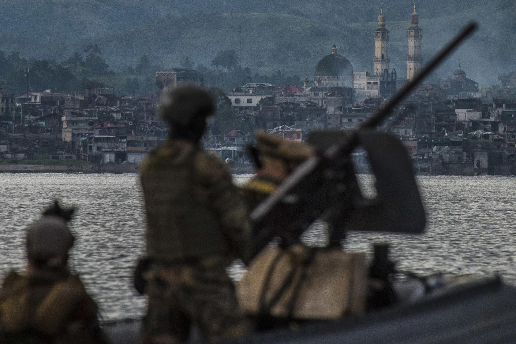 Philippines Navy Special Forces patrol a lake near the main battle area where Islamic State militants are holed up in Marawi, Philippines. September 15, 2017. (Jes Aznar/The New York Times)