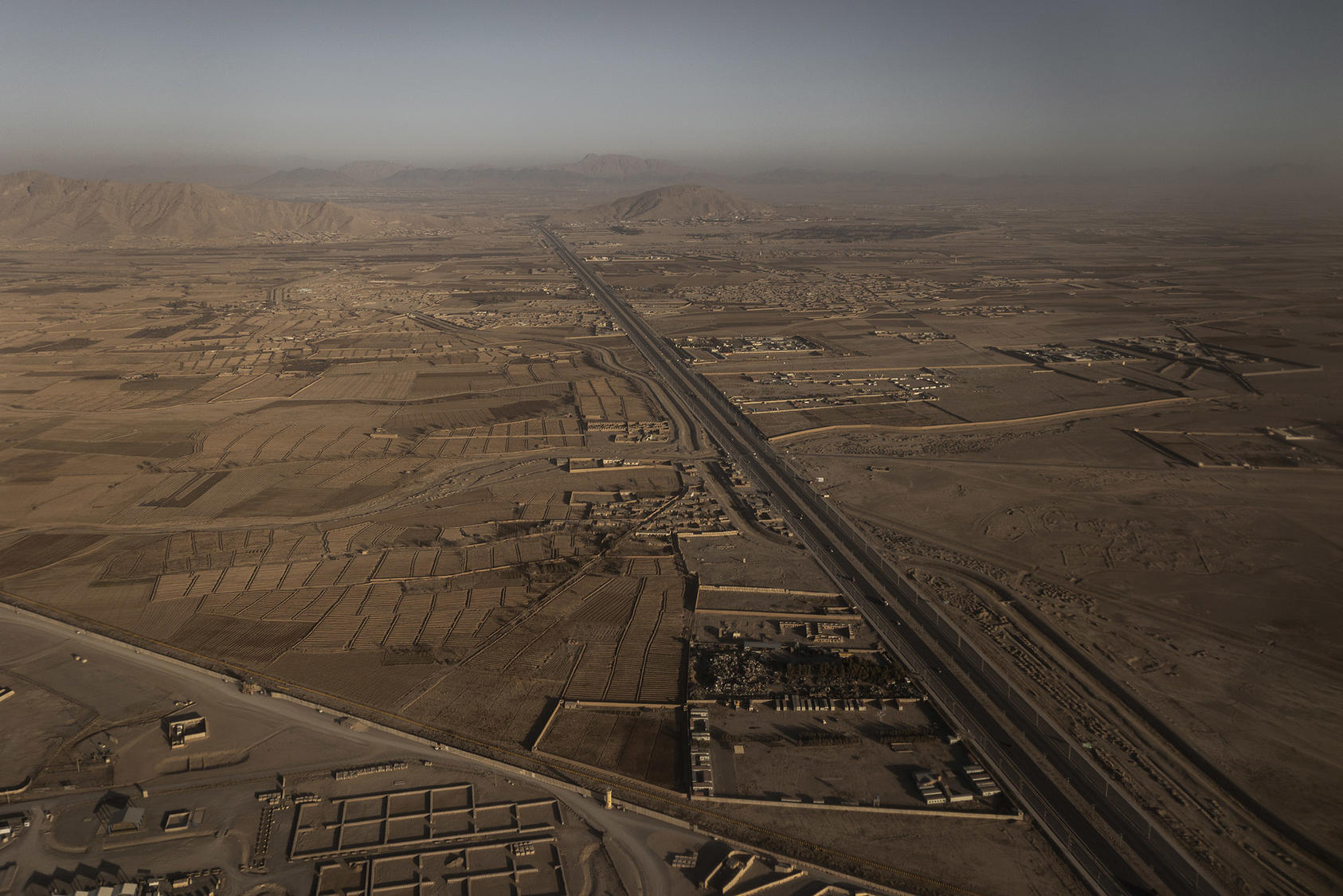 The road connecting Spin Boldak, a town and border crossing with Pakistan, to Kandahar, Afghanistan. February 1, 2021. (Jim Huylebroek/The New York Times)