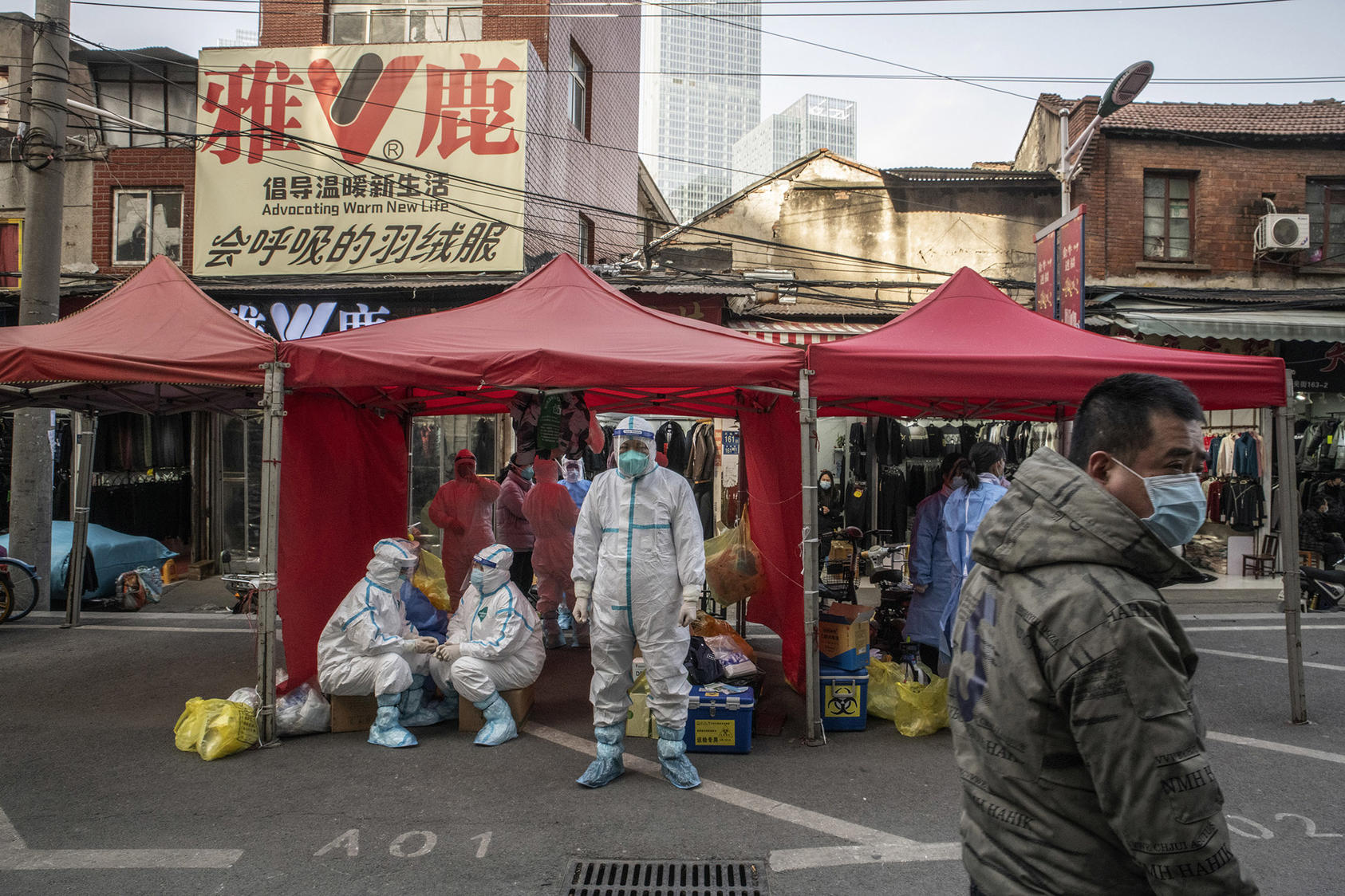 Health workers during a COVID alert in Wuhan, China on Jan. 11, 2021. (Gilles Sabrie/The NewYork Times)