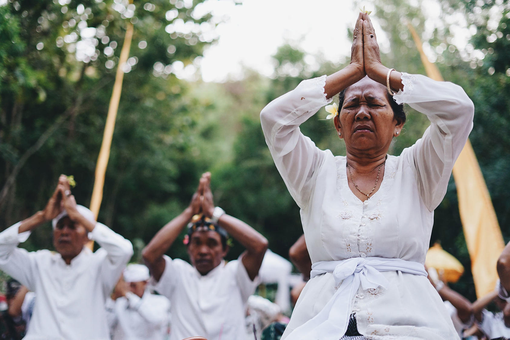 A woman participates in spiritual practice in Bali, Indonesia. While Islam is by far the dominant religion in Indonesia, there are small but growing minority populations from other religious traditions including Christianity and Hinduism. 