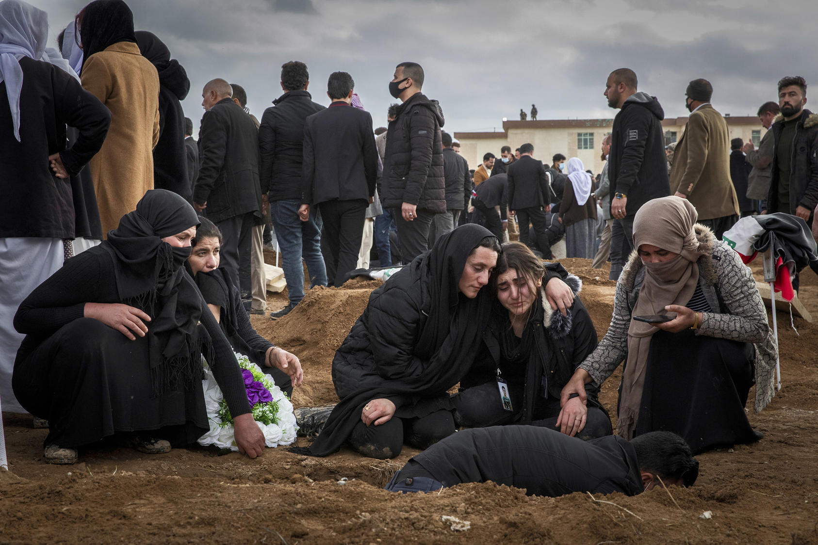Relatives of Iraqi Yazidis killed by ISIS comfort each other last year during re-burials of 103 bodies found in a mass grave. Yazidis and other minorities still struggle for representation in Iraq’s government. (Ivor Prickett/The New York Times)