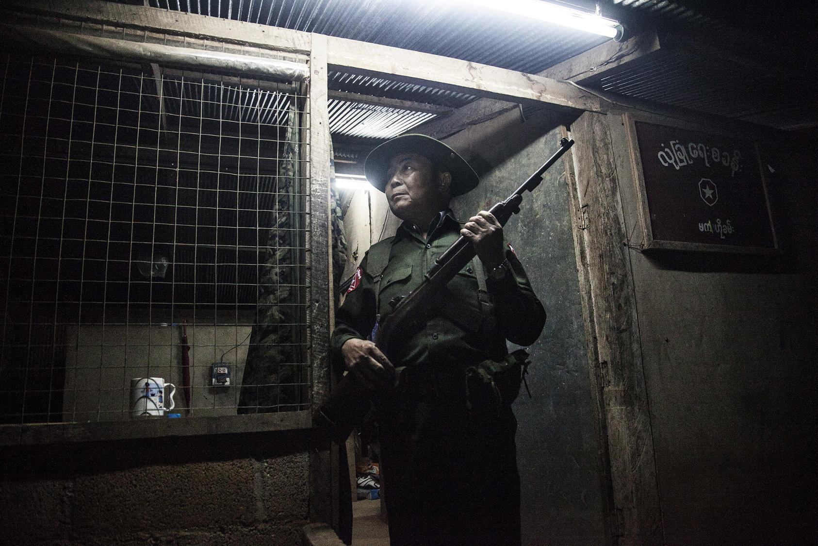 A Burmese soldier at the border with Thailand in Tachileik, Myanmar. November 20, 2013. (Guillem Valle/ The New York Times)