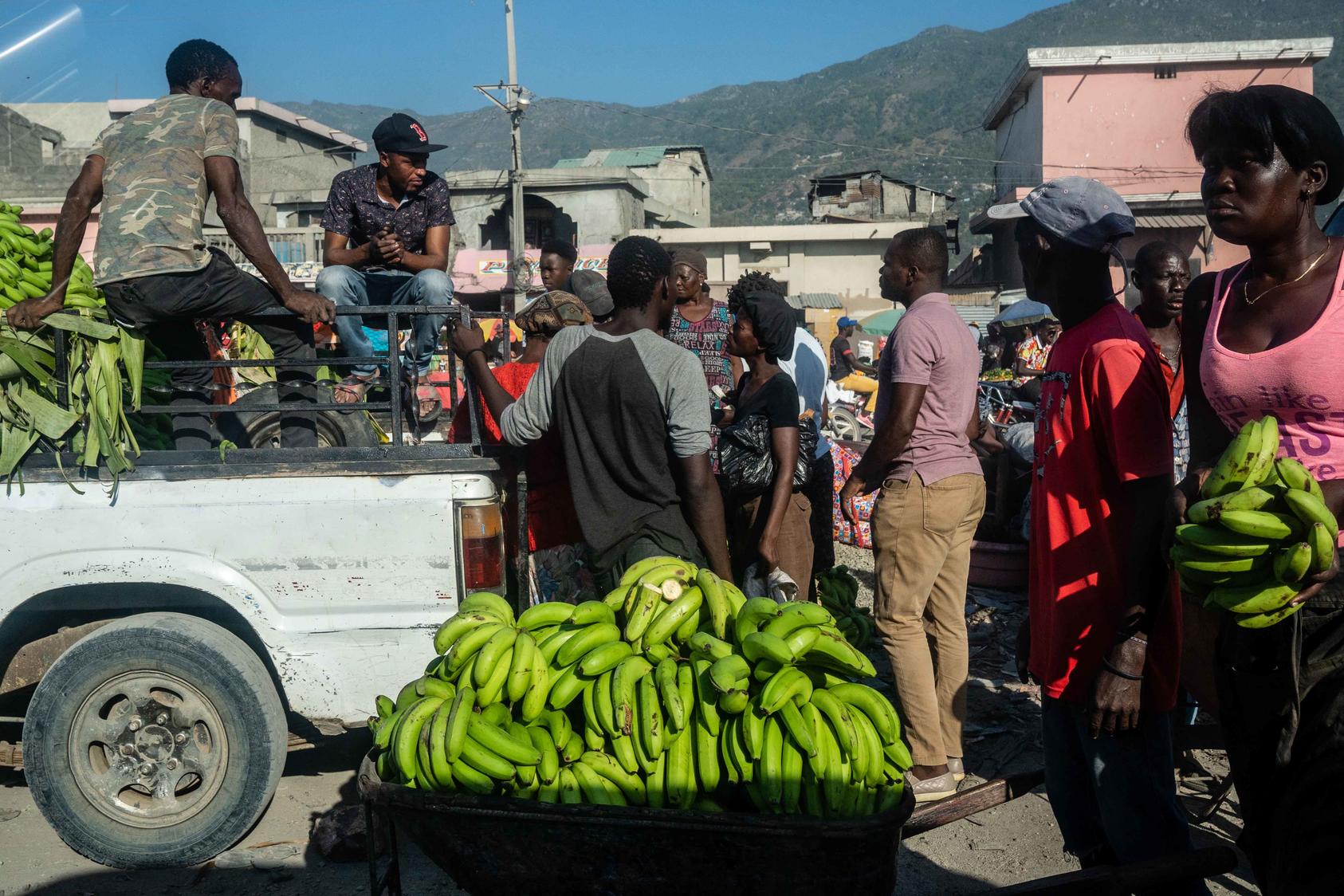 Street vendors in Cape Haitien, Haiti, July 16, 2021. A cycle of crisis and U.S. intervention in Haiti has persisted for decades, but a new U.S. plan is focused on the long term challenges facing Haiti. (Federico Rios/The New York Times)