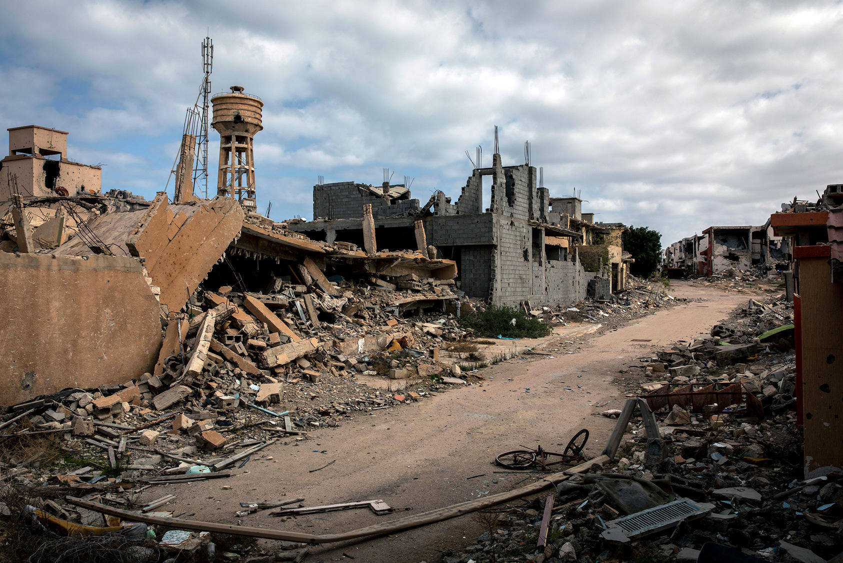 Sirte, the former hometown and stronghold of Muammar Qaddafi, stood in ruins in 2020 after battles between Libyan factions. In other locales, local Libyan peacebuilders have been able to halt or avert warfare. (Ivor Prickett/The New York Times)