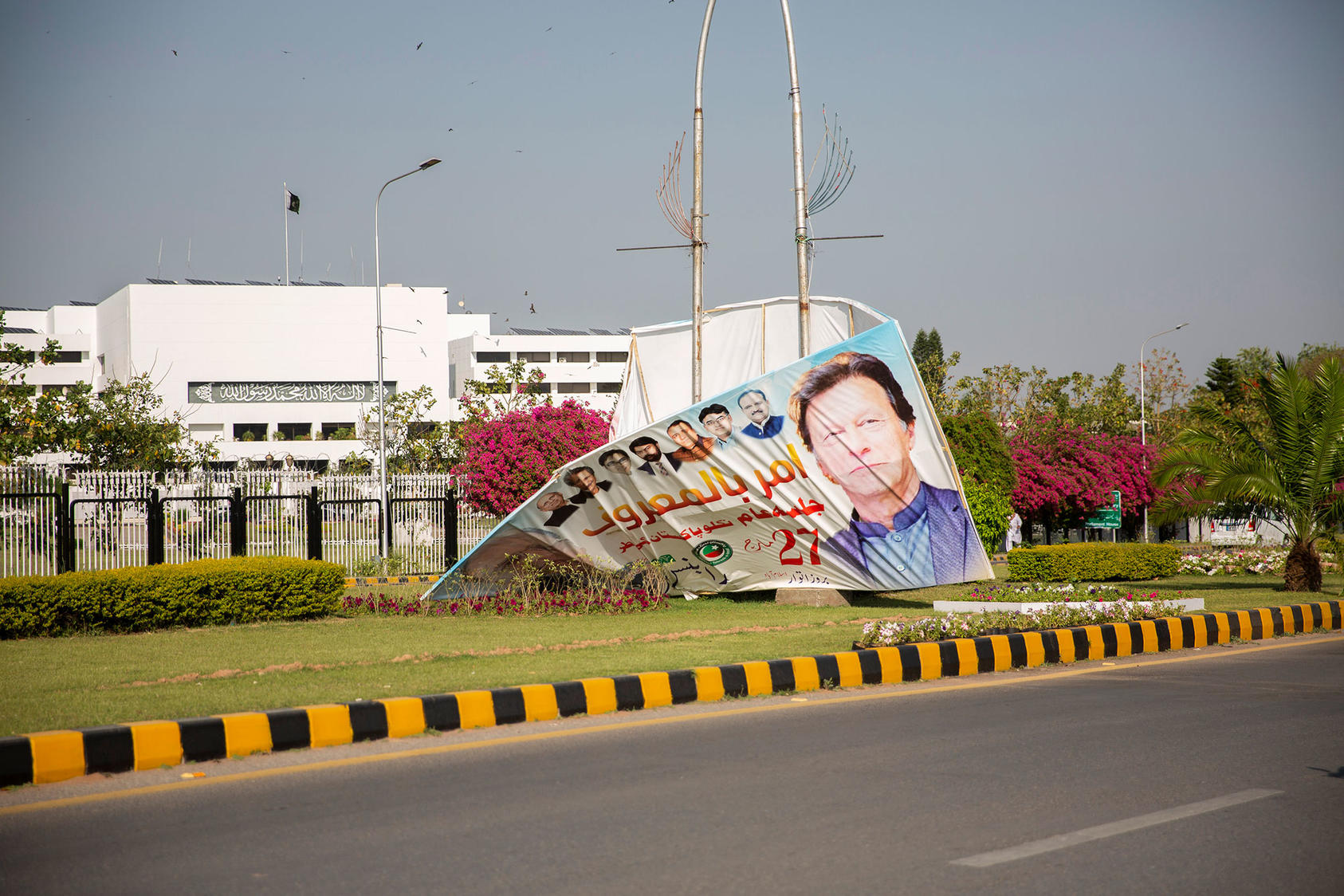 A poster of deposed Prime Minister Imran Khan in front of the National Assembly in Islamabad on Monday, April 4, 2022. Khan was removed from office on April 10 following a vote of no confidence. (Saiyna Bashir/The New York Times)
