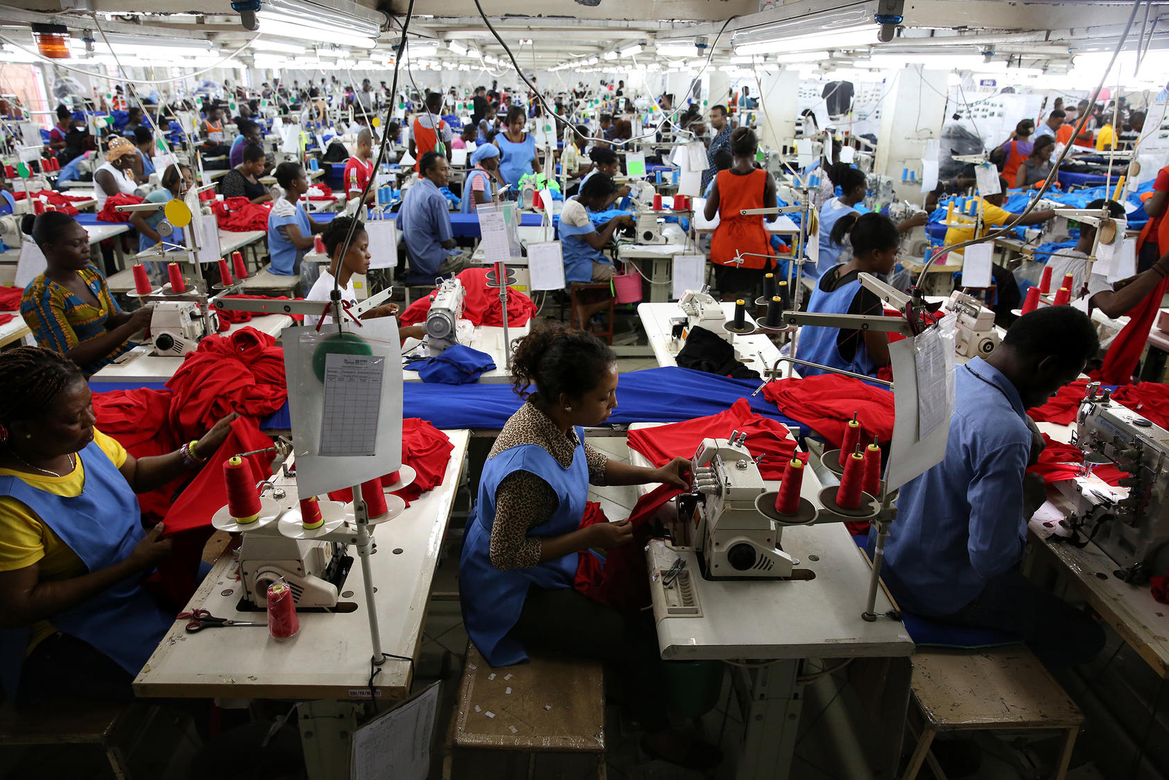 Ghanaians sew shirts for export at Dignity DTRT, a factory in Accra funded largely by U.S. investors. The firm trains and employs thousands of people in an economy whose growth is vital to sustaining Ghana’s 30-year democracy. (Dominic Chavez/World Bank)