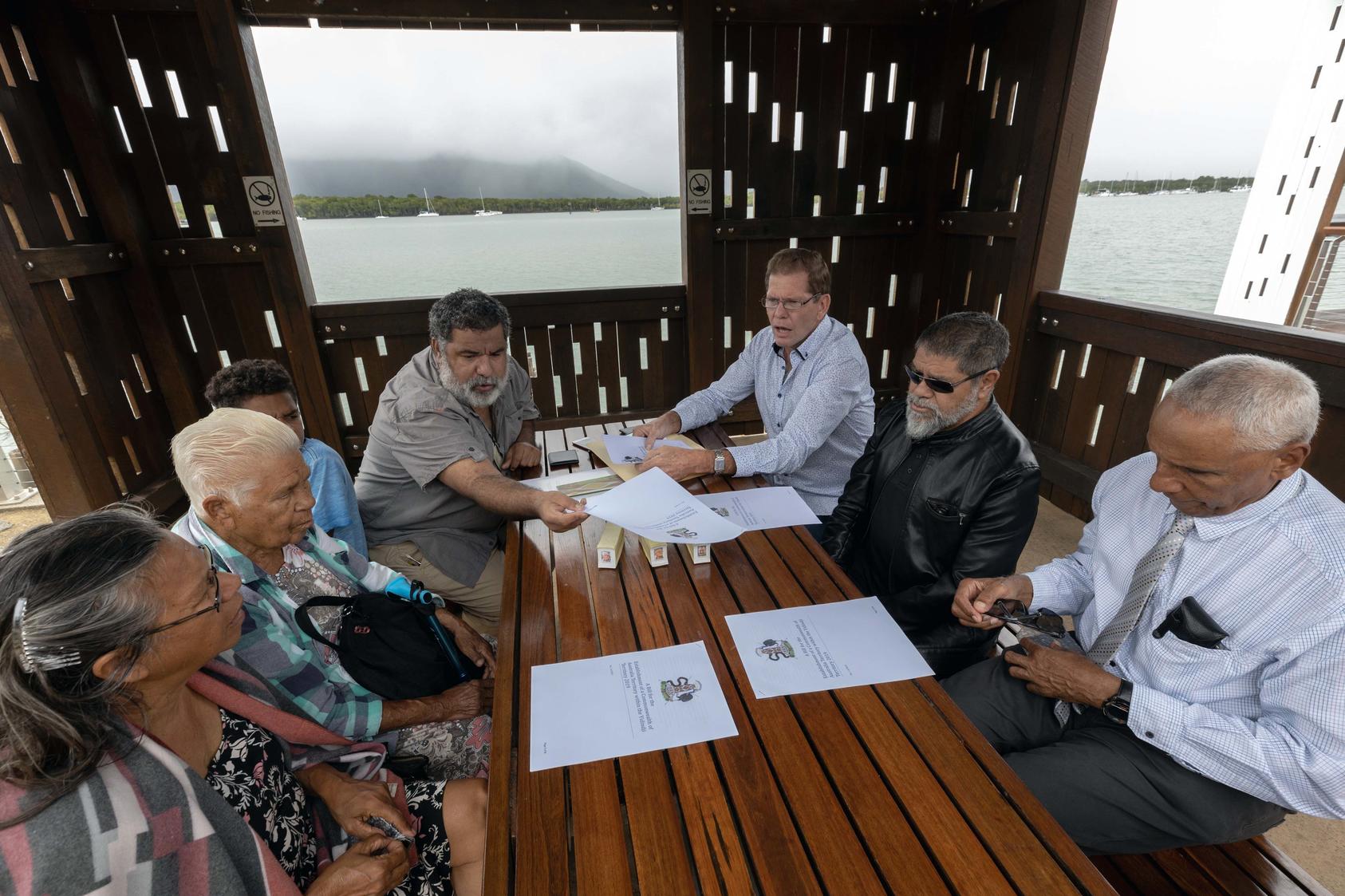: Leaders of the Aboriginal-Australian Yidinji Territory at a weekly meeting in Cairns, Australia, discussing their hopes to sign a treaty with the Australian government. August 7, 2019. (Brook Mitchell/The New York Times)