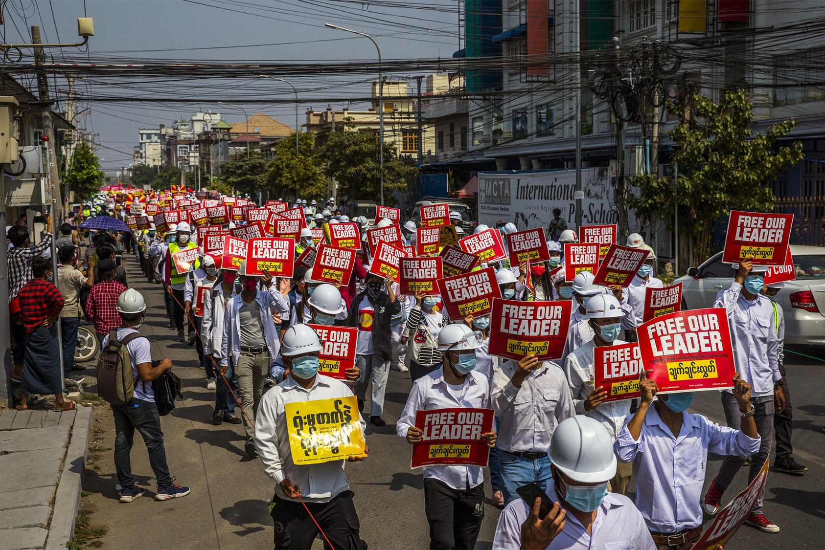 Medical students, doctors and engineers march in Yangon, Myanmar, on Feb. 26, 2021 to protest against the military coup earlier that month. (The New York Times)