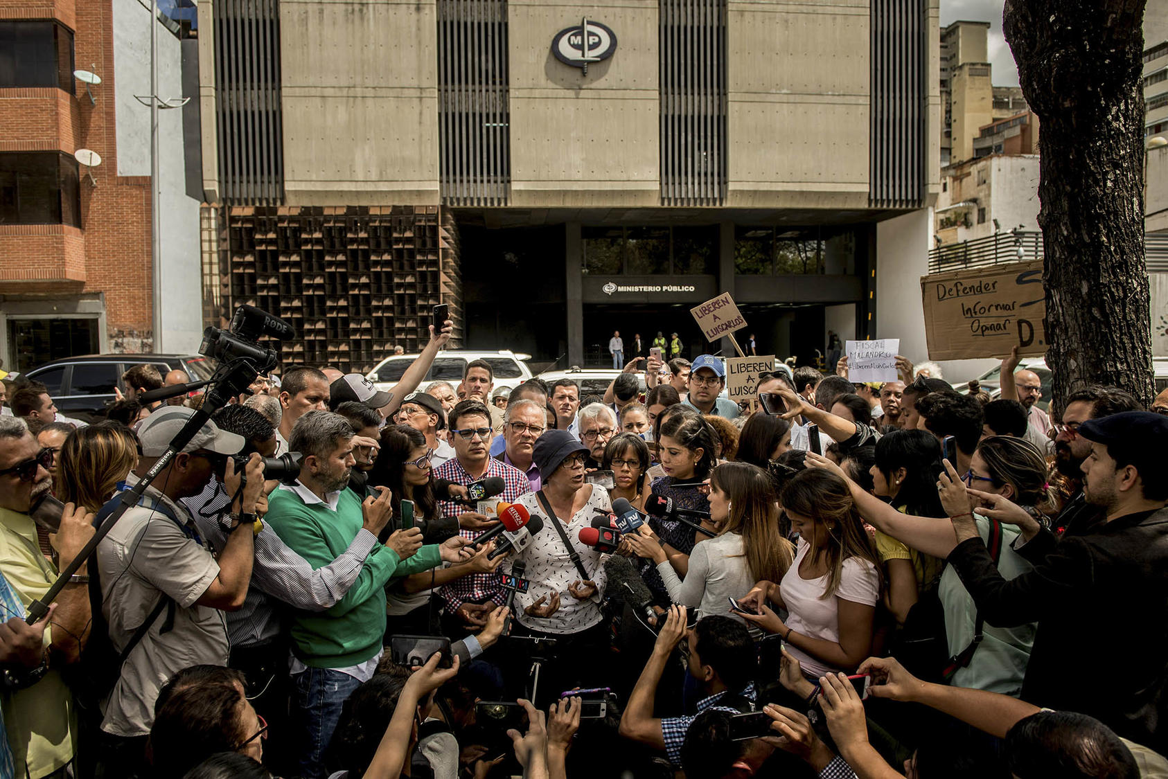 Naky Soto, the wife of detained radio producer and social media activist Luis Carlos Díaz, speaks to reporters outside Attorney General Tarek Saab's office in Caracas, Venezuela, March 12, 2019. (Meridith Kohut/The New York Times)