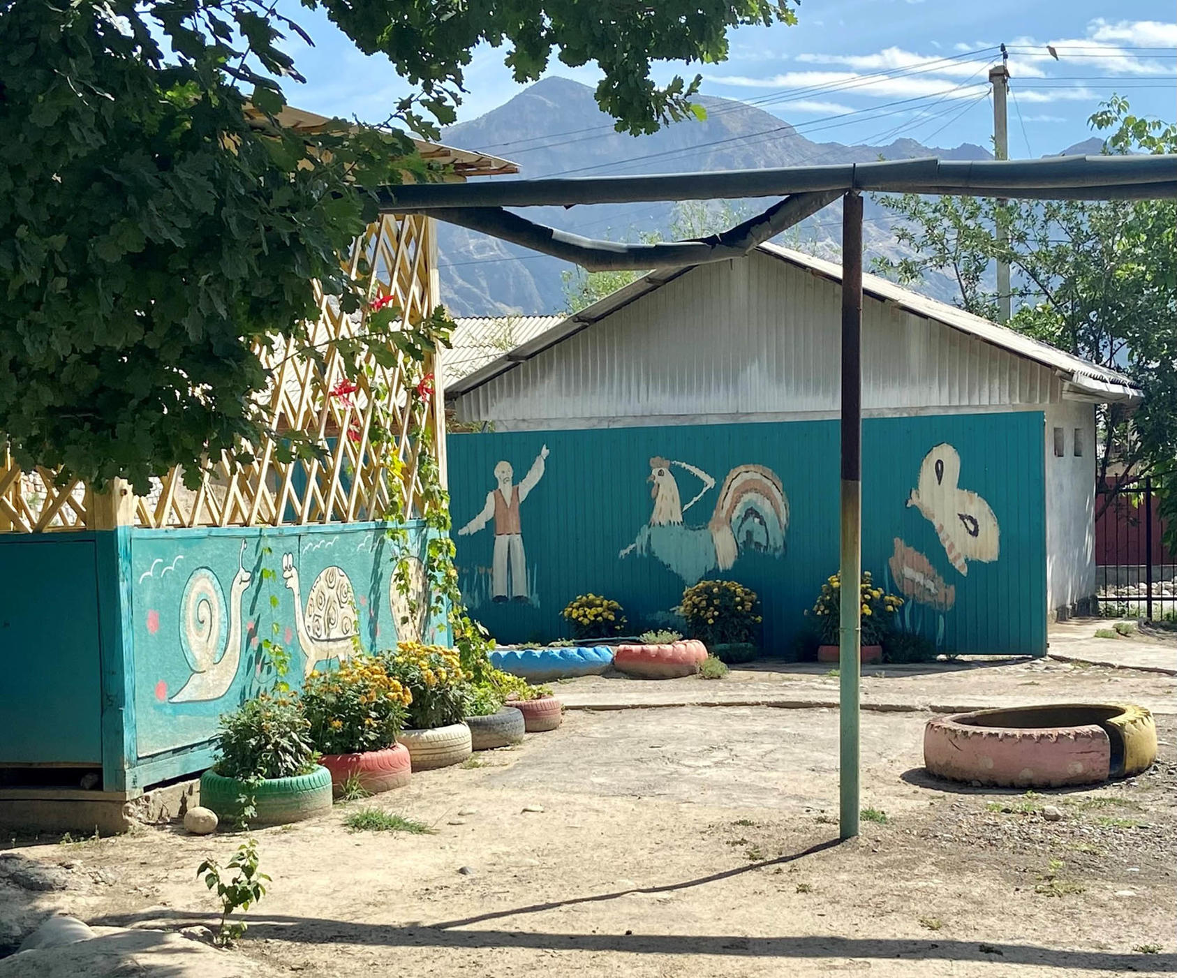 A schoolyard in Aravan, Kyrgyzstan where children repatriated from displacement camps in Iraq are receiving basic education and tutoring, June 2022.