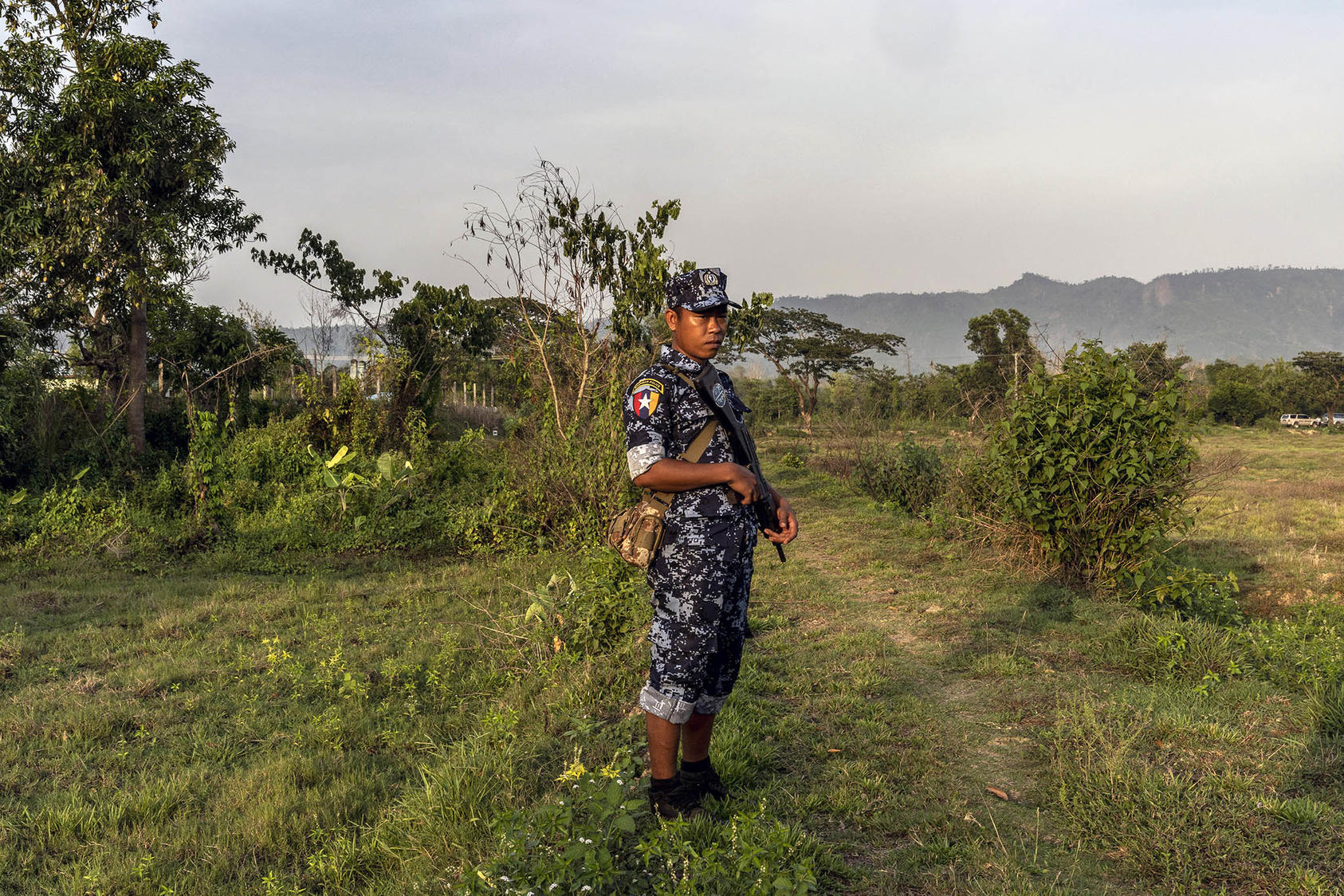 A border guard blocks near Muangdaw, Myanmar, during a government-led tour of Rakhine State on May 29, 2019. (Adam Dean/The New York Times)