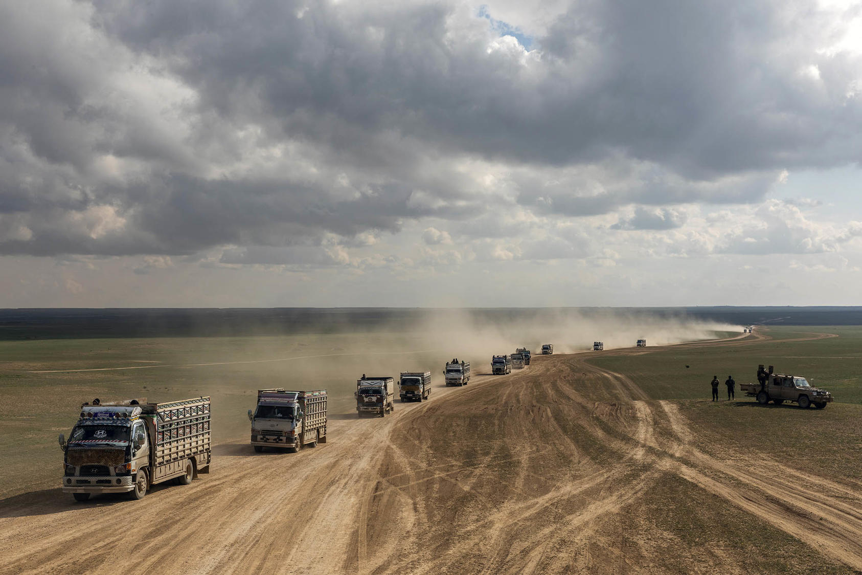 A convoy of trucks carrying people to detention camps on Nov. 2, 2019 after they had fled areas held by the Islamic State in eastern Syria. (Ivor Prickett/The New York Times)