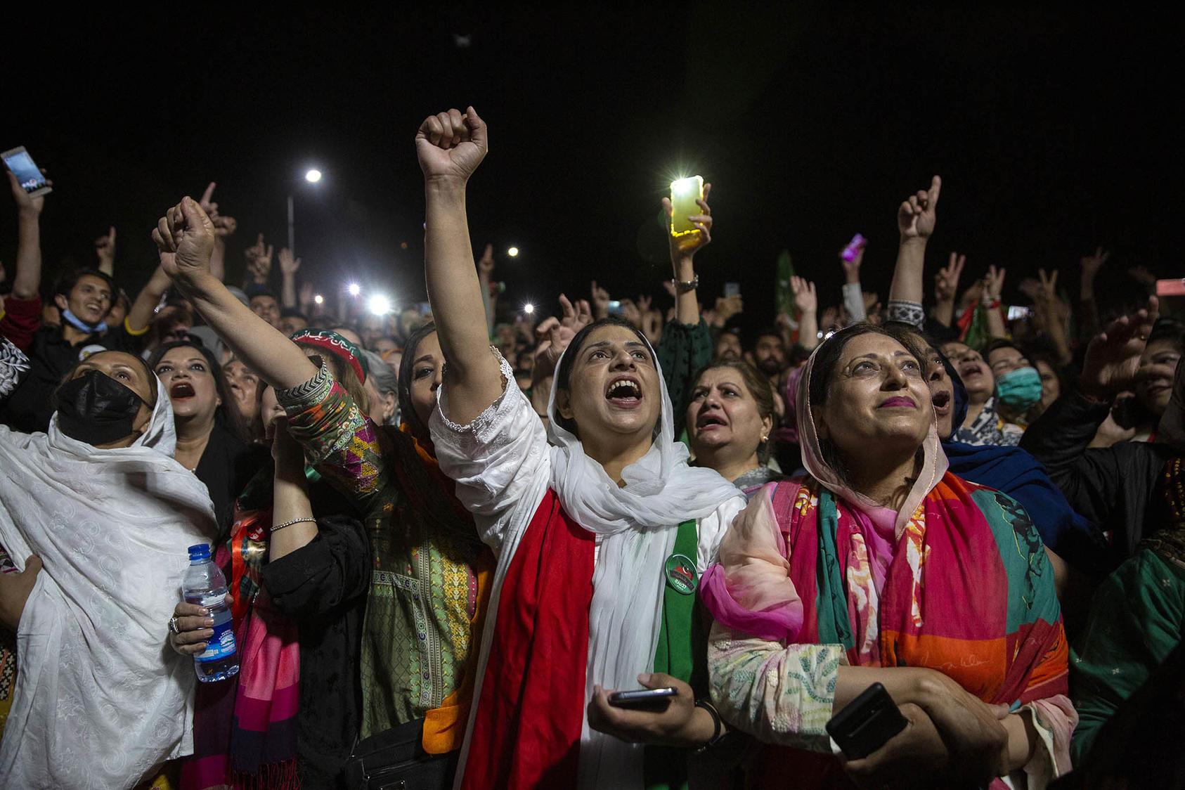 Supporters of Prime Minister Imran Khan rally in Islamabad, Pakistan, on Monday night, April 4, 2022.  (Saiyna Bashir/The New York Times)