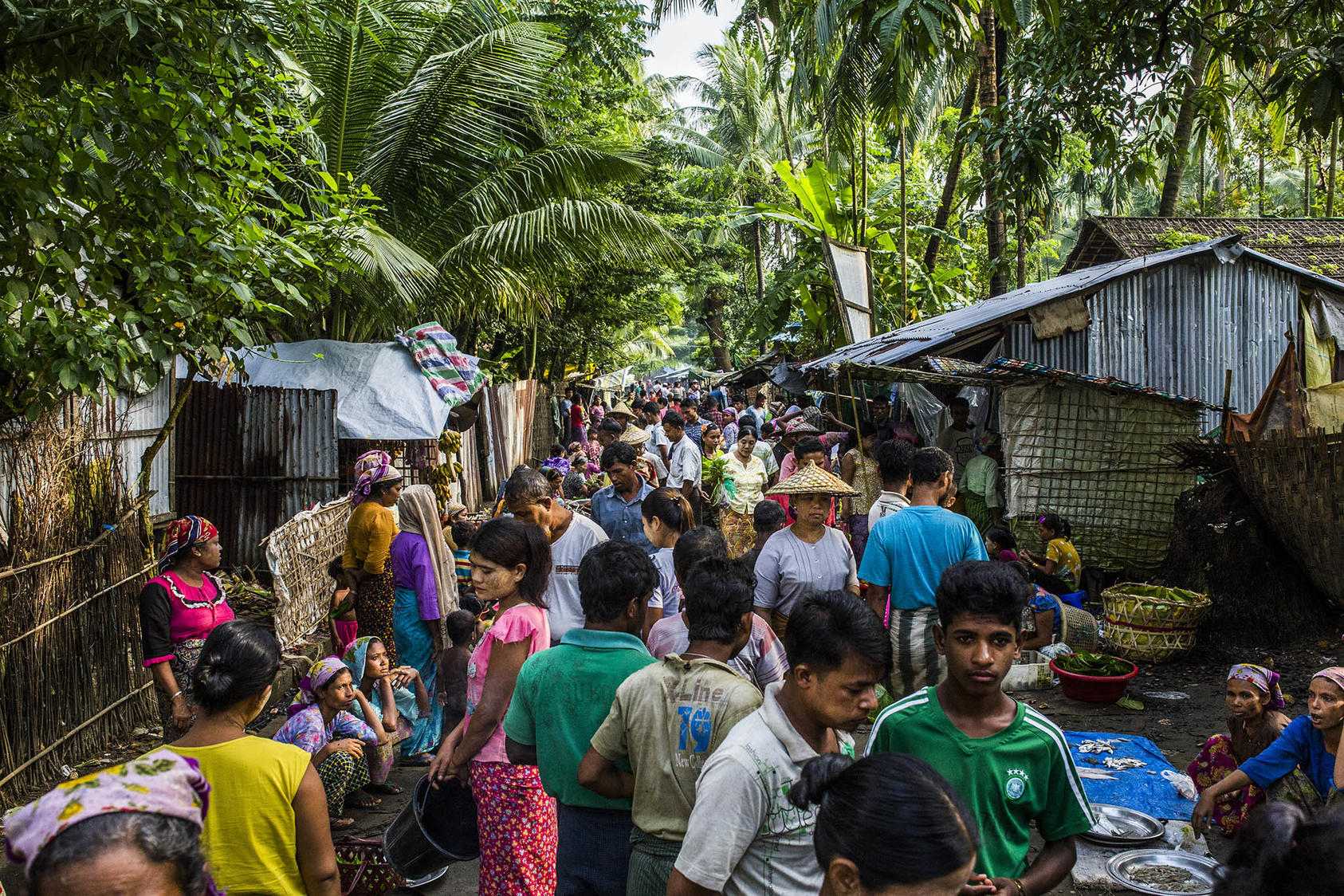 Buddhists and Muslims in a market in the village of Sin Tet Maw in Myanmar's Rakhine State, Sept. 10, 2018. (Minzayar Oo/The New York Times)