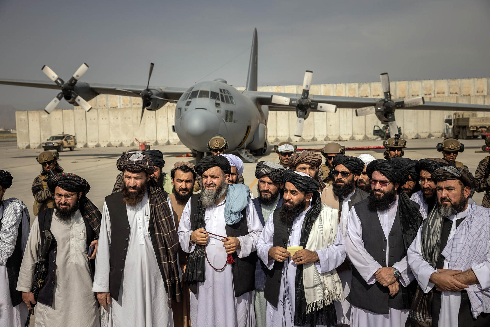 Taliban officials declare victory at the Kabul airport on Aug. 31, 2021. (Jim Huylebroek/The New York Times)