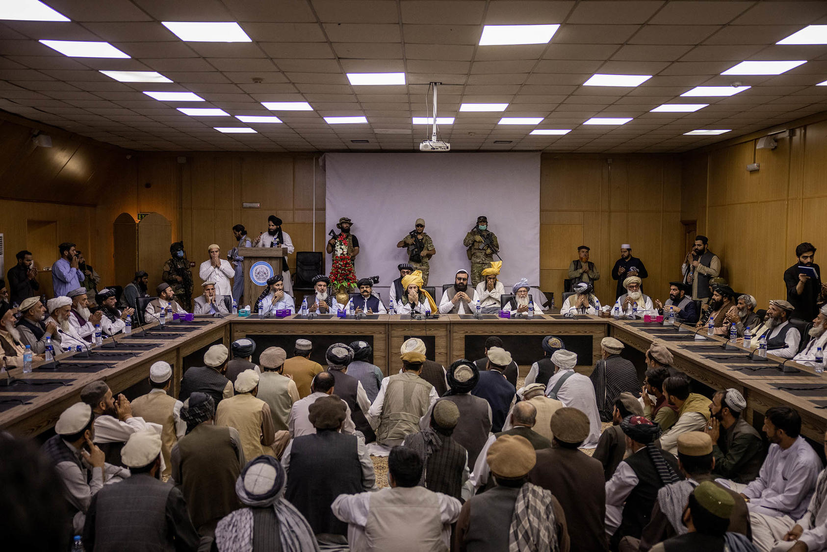 Khalil Haqqani, the current interim minister for refugees of the Taliban's government, center, leads a gathering of tribal elders in Kabul, Afghanistan on Aug. 26, 2021. (Jim Huylebroek/The New York Times)