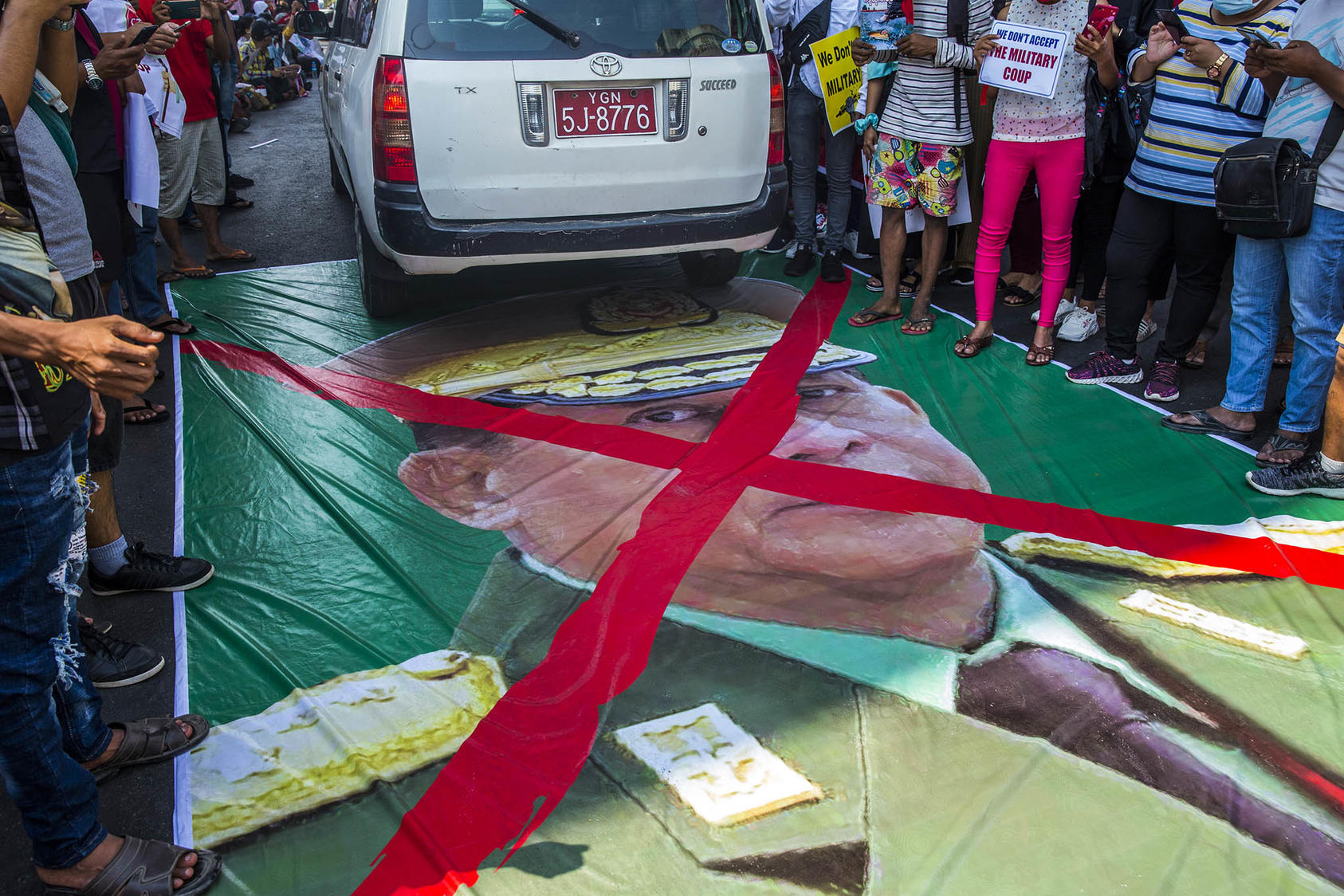 A poster of Senior Gen. Min Aung Hlaing, who led the coup, on the street during a protest in Yangon, Myanmar. February 19, 2021. (The New York Times)