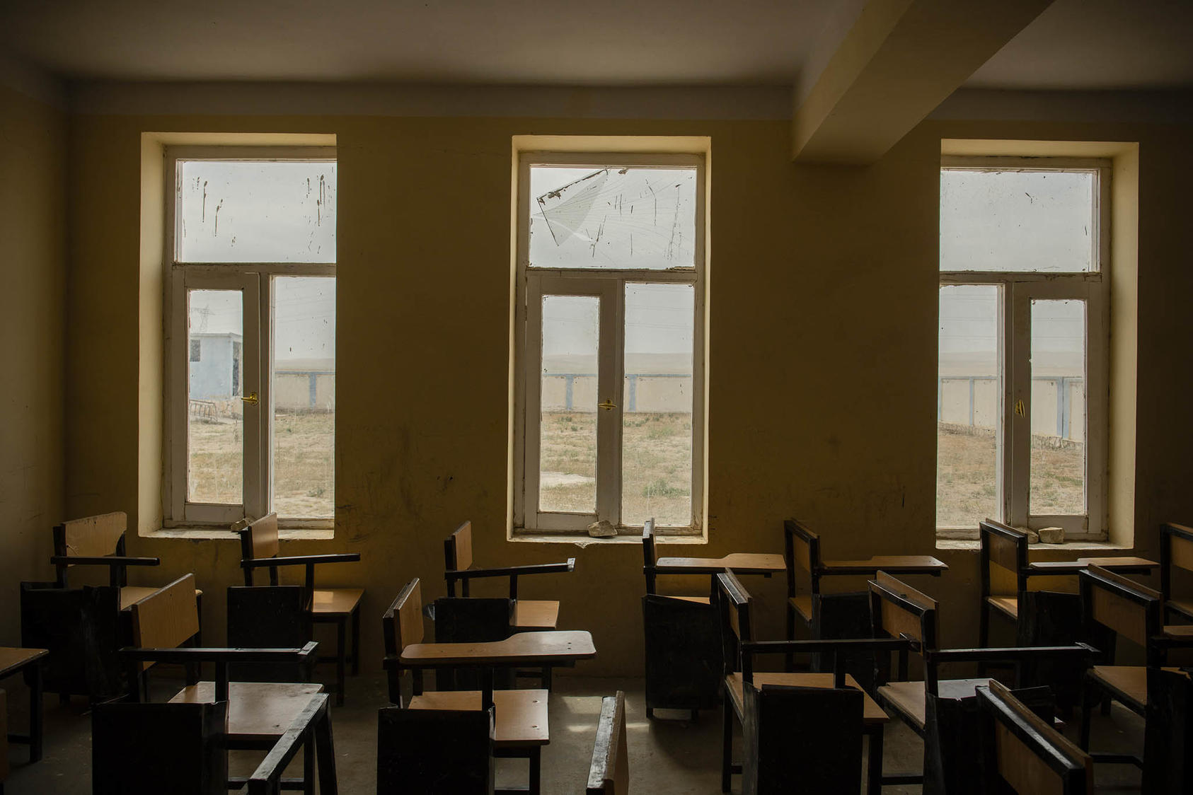 A school that was damaged during a battle between Afghan government forces and the Taliban just outside Sheberghan, Afghanistan. May 4, 2021. (Kiana Hayeri/The New York Times)