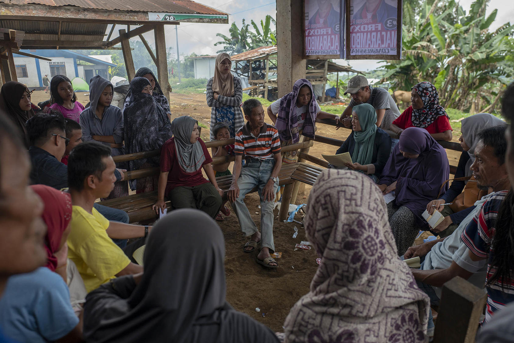 Macaraya Ampuan, an influential leader who once commanded the Moro Islamic Liberation Front unit, in a meeting with villagers, contractors, and NGO workers on a new water pump in Padas, the Philippines, April 13, 2019. (Jes Aznar/The New York Times)